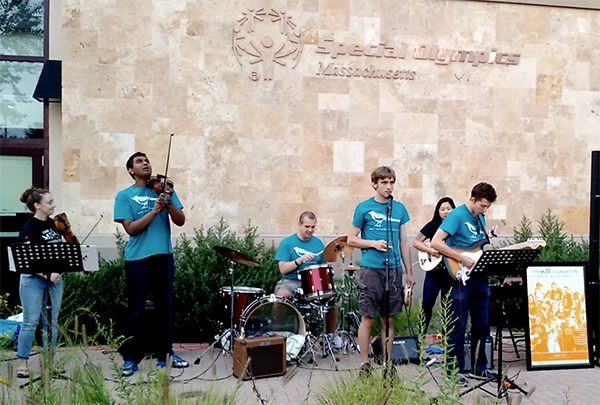 The Brookline Buds performing in August. The band includes the author’s son Nat Batchelder (at microphone), Sri Sundar (violin), Theo Chartier (drums), Stefano Micali (guitar), Miyabe Shields (behind Stefano), and Elaine Shields (on left).