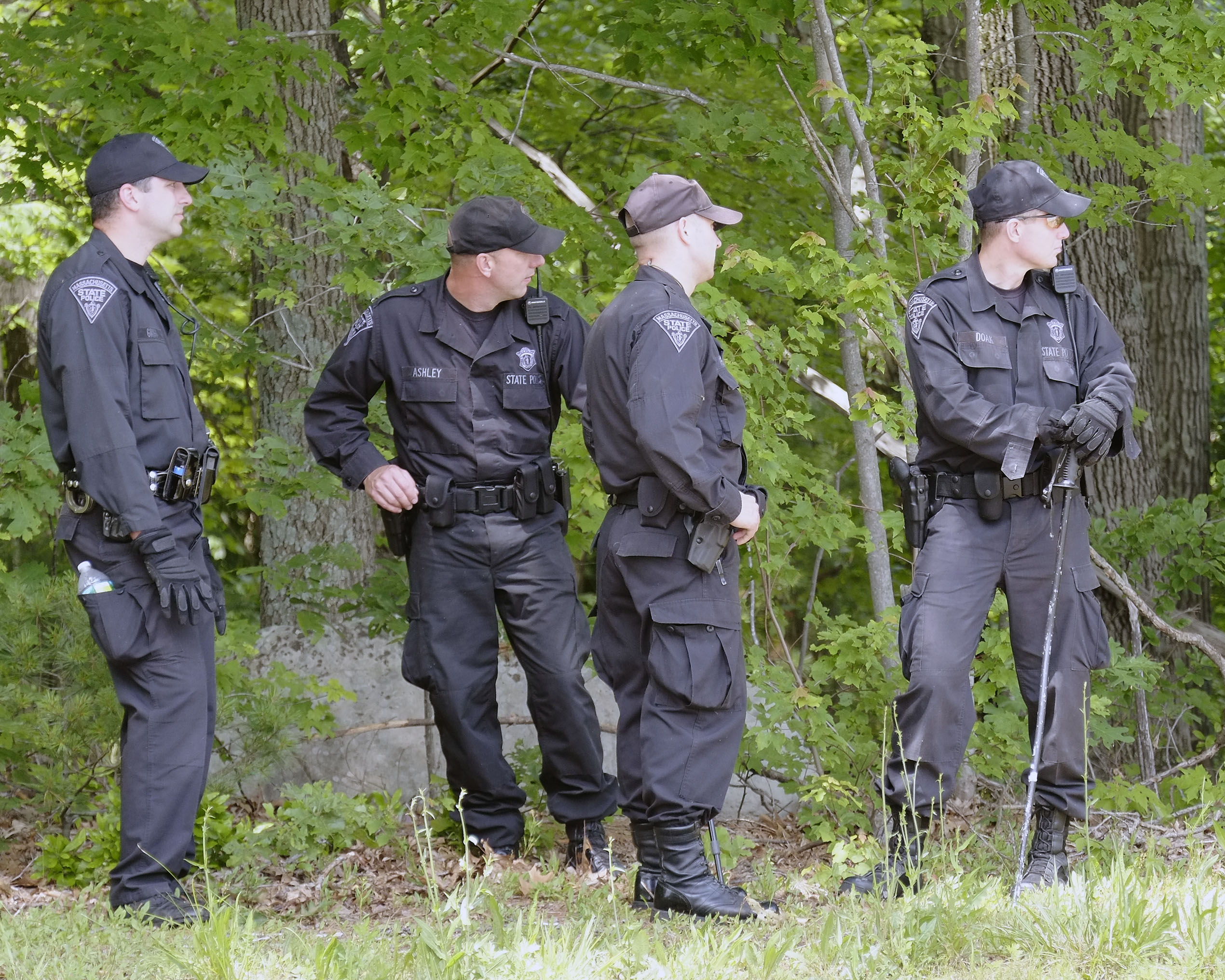 State Police searched a wooded area in North Attleboro Wednesday.
