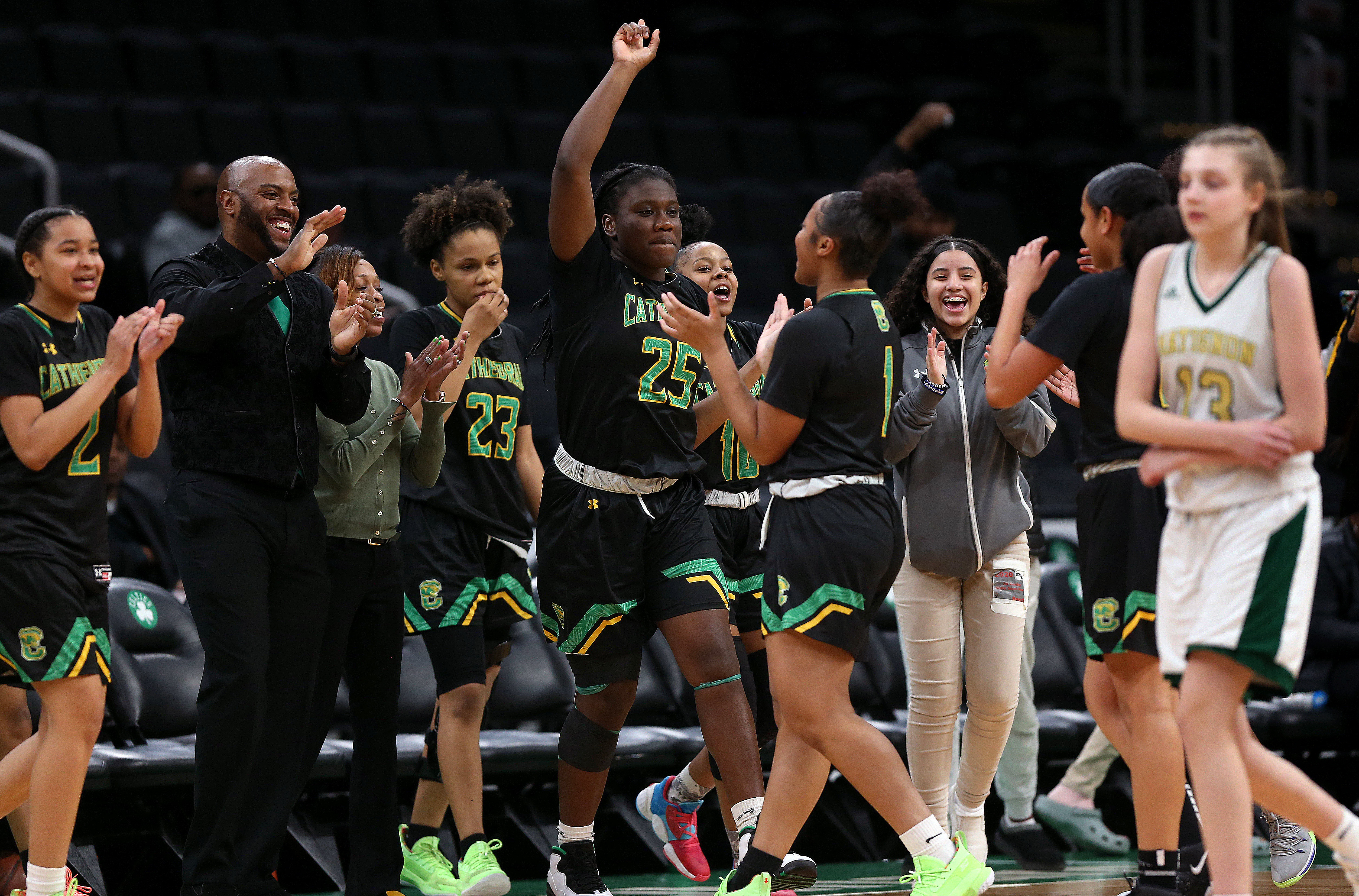 Cathedral girls' basketball players celebrate their win over Matignon, which sent the Panthers to their fifth state final in six seasons.