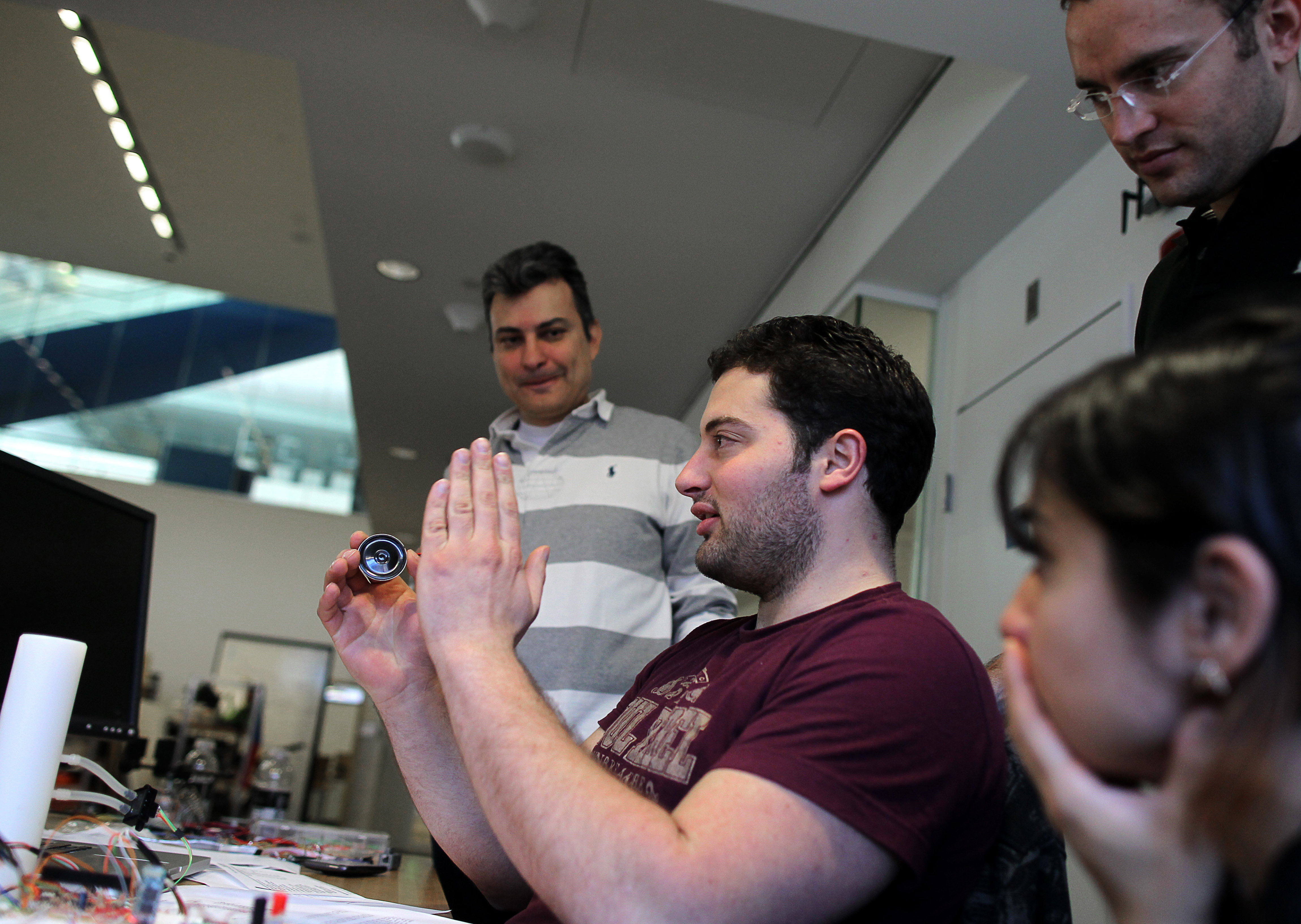 Ioannis Smanis (center) and his team designed a prototype inhaler-spacer-spirometer, specifically for children with asthma. Teams at the MIT Media Lab made devices to aid patients.