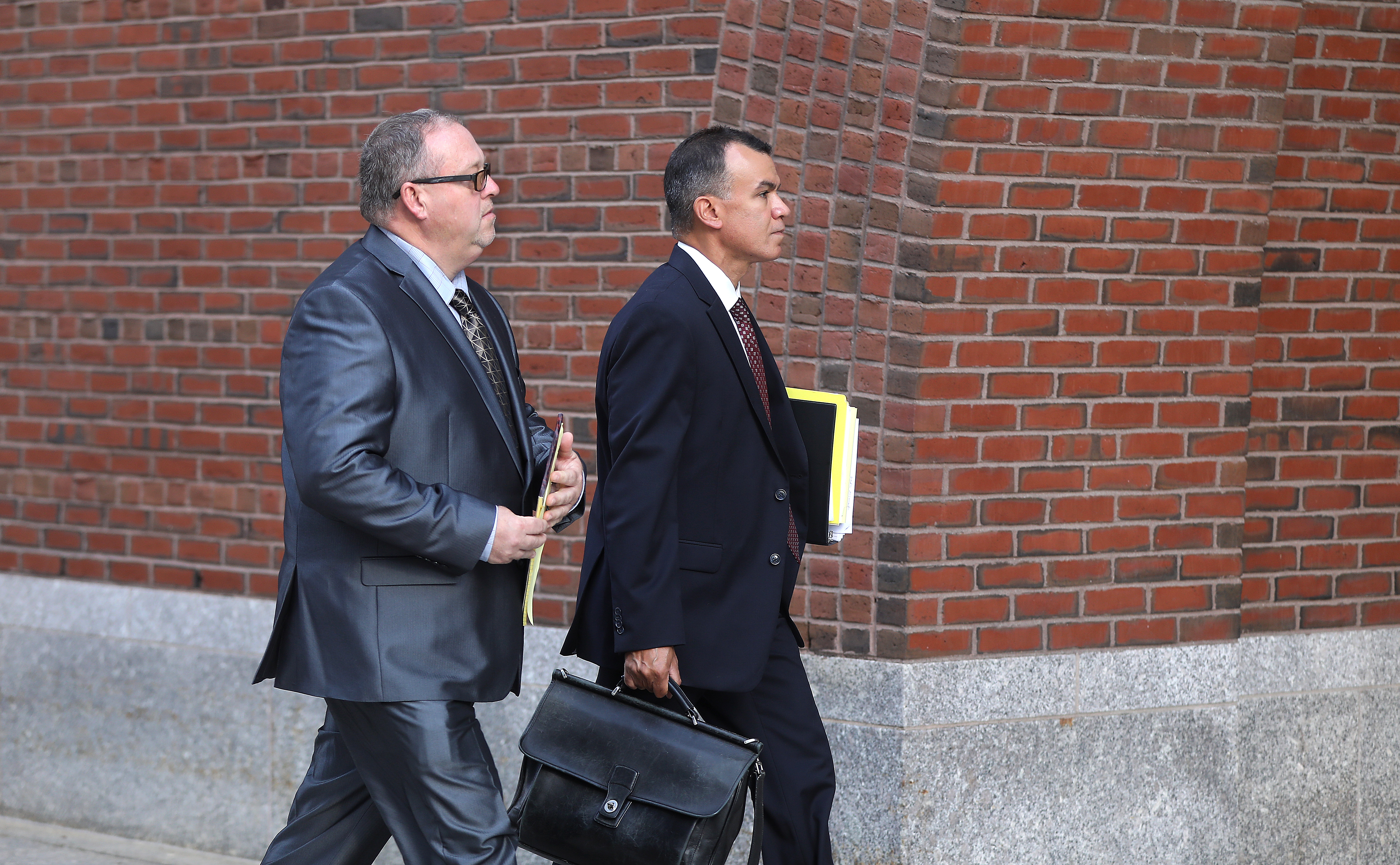 Daniel Redmond (left) walked with his attorney, Oscar Cruz.