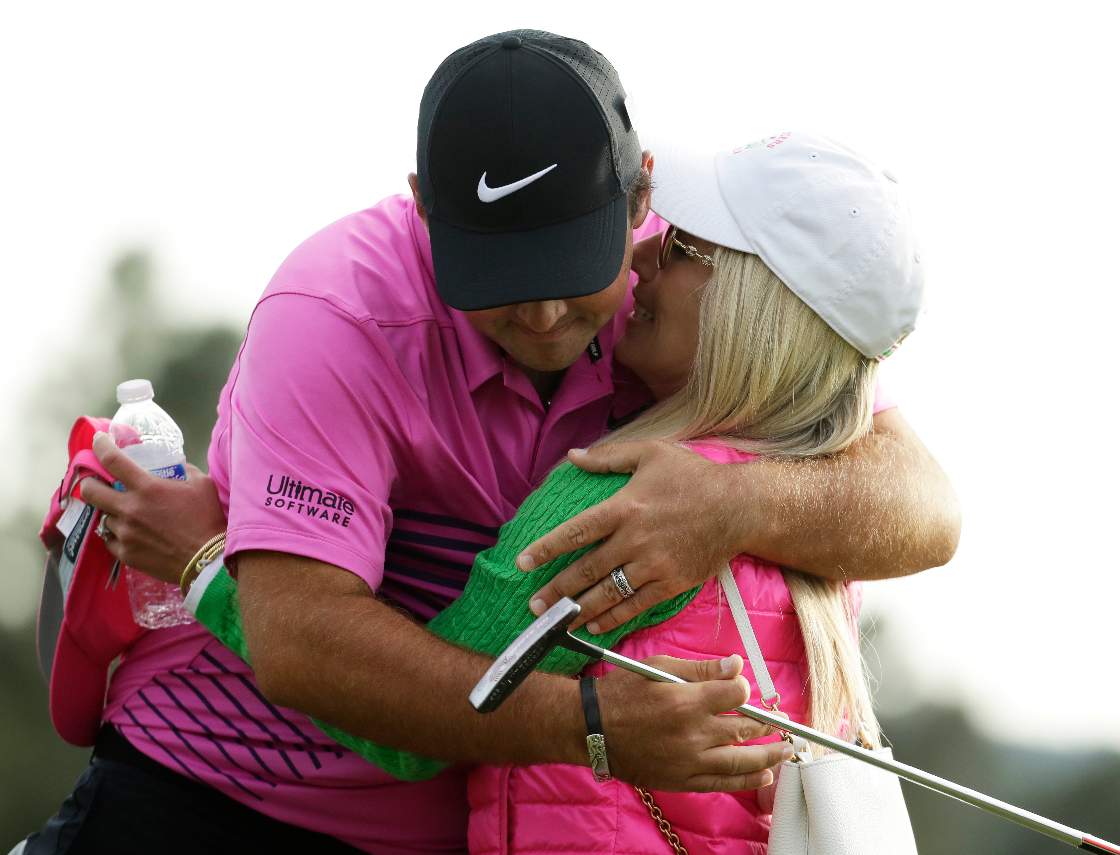 Patrick Reed hugged his wife, Justine Karain, after winning the Masters golf tournament Sunday.