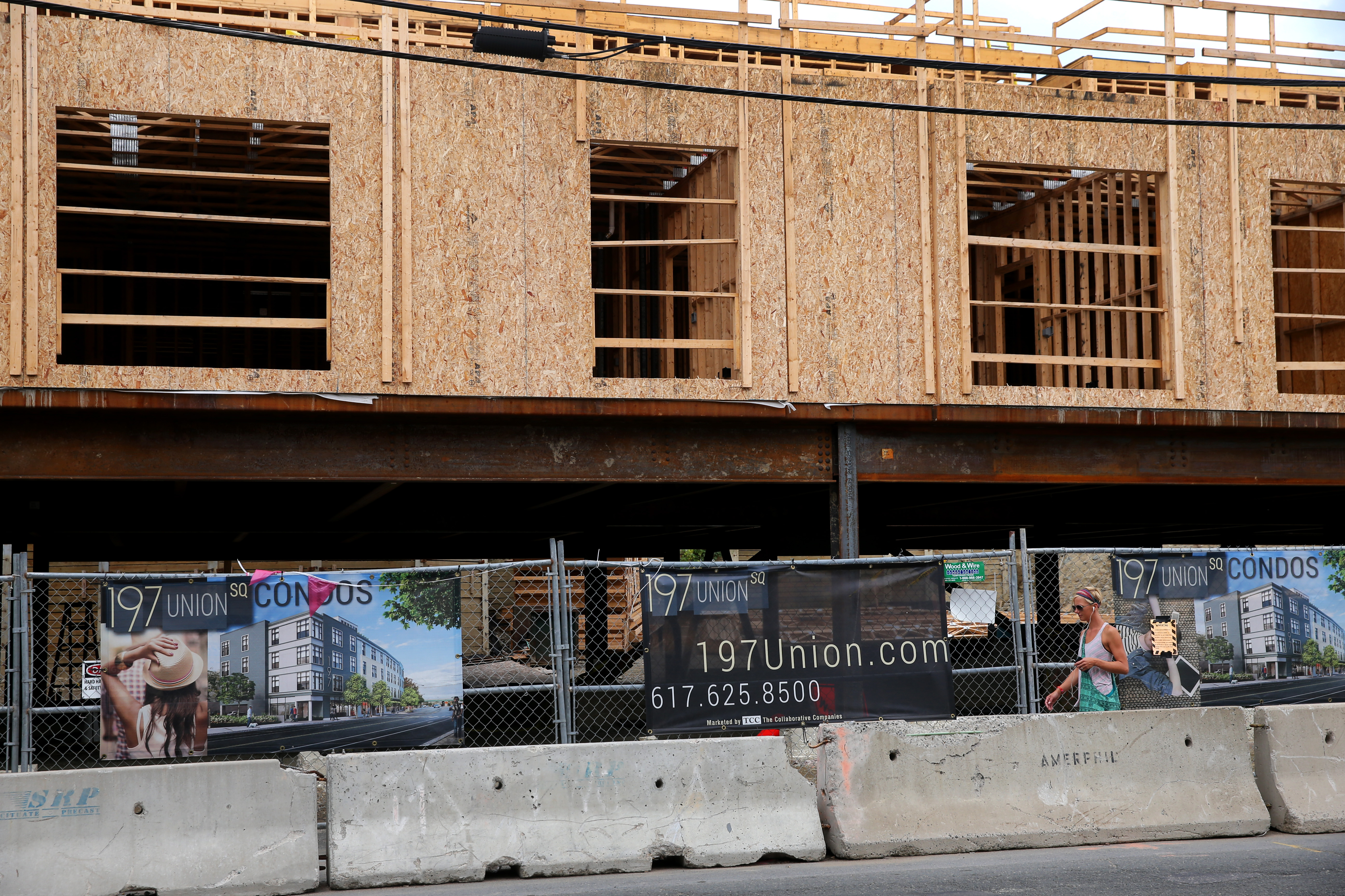 A condo building rising on Washington Street in Somerville, near Union Square, hopes to take advantage of the planned Green Line project.