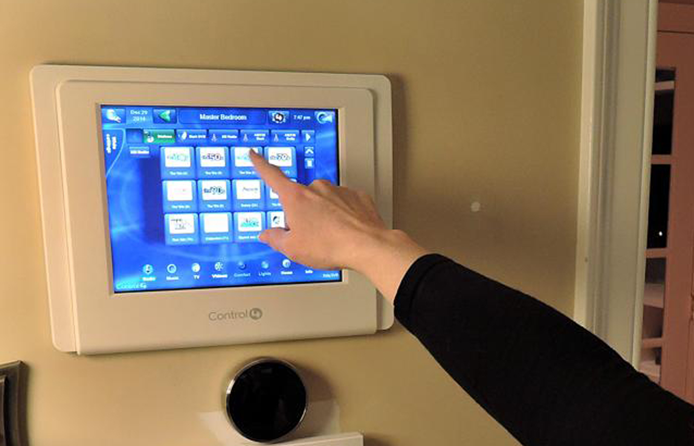 Thanks to Control4, the DeNyses can use their smartphones or this touchpad to turn on the lights.