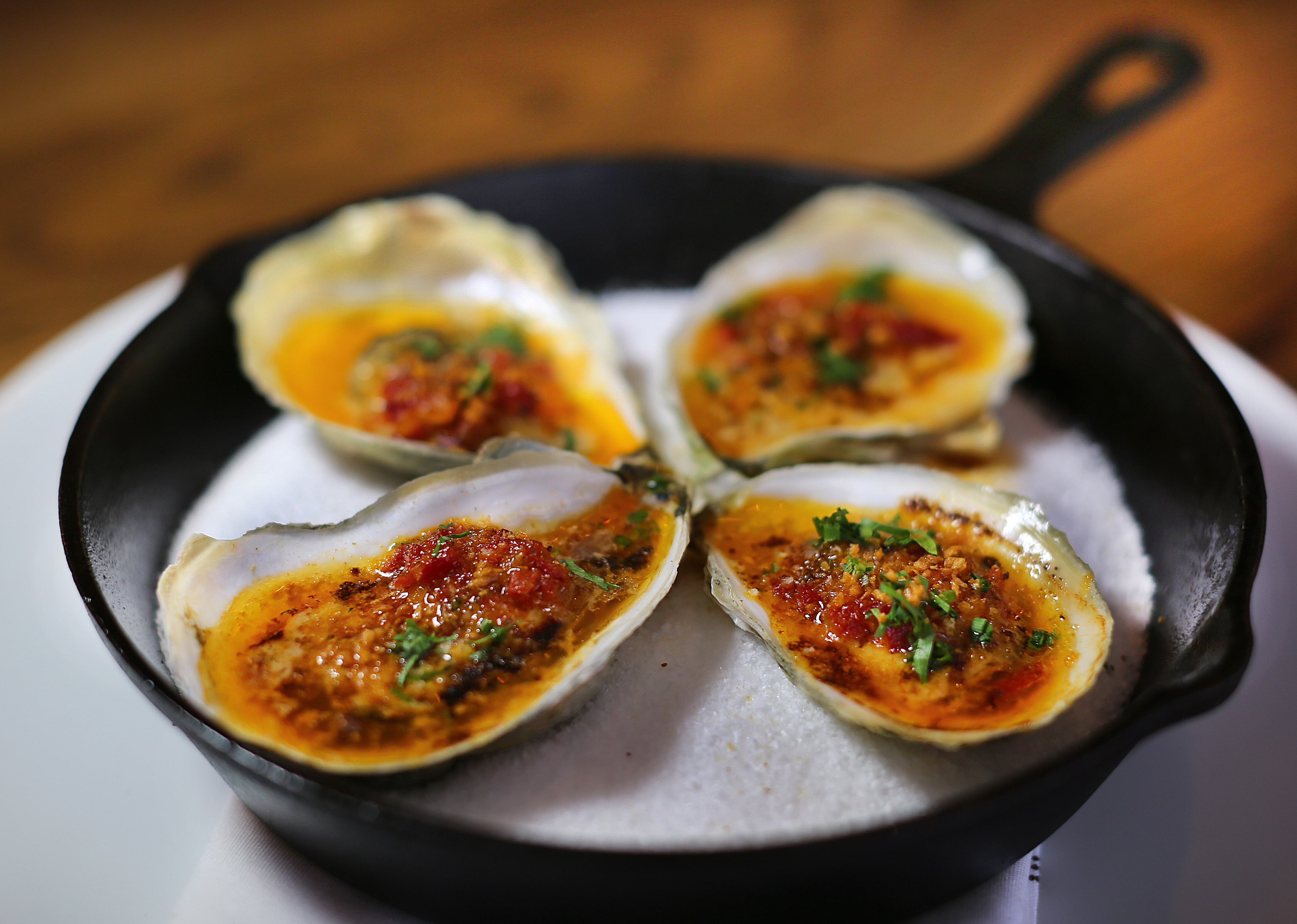 Roasted oysters bathed in butter, uni, and piquillo peppers.