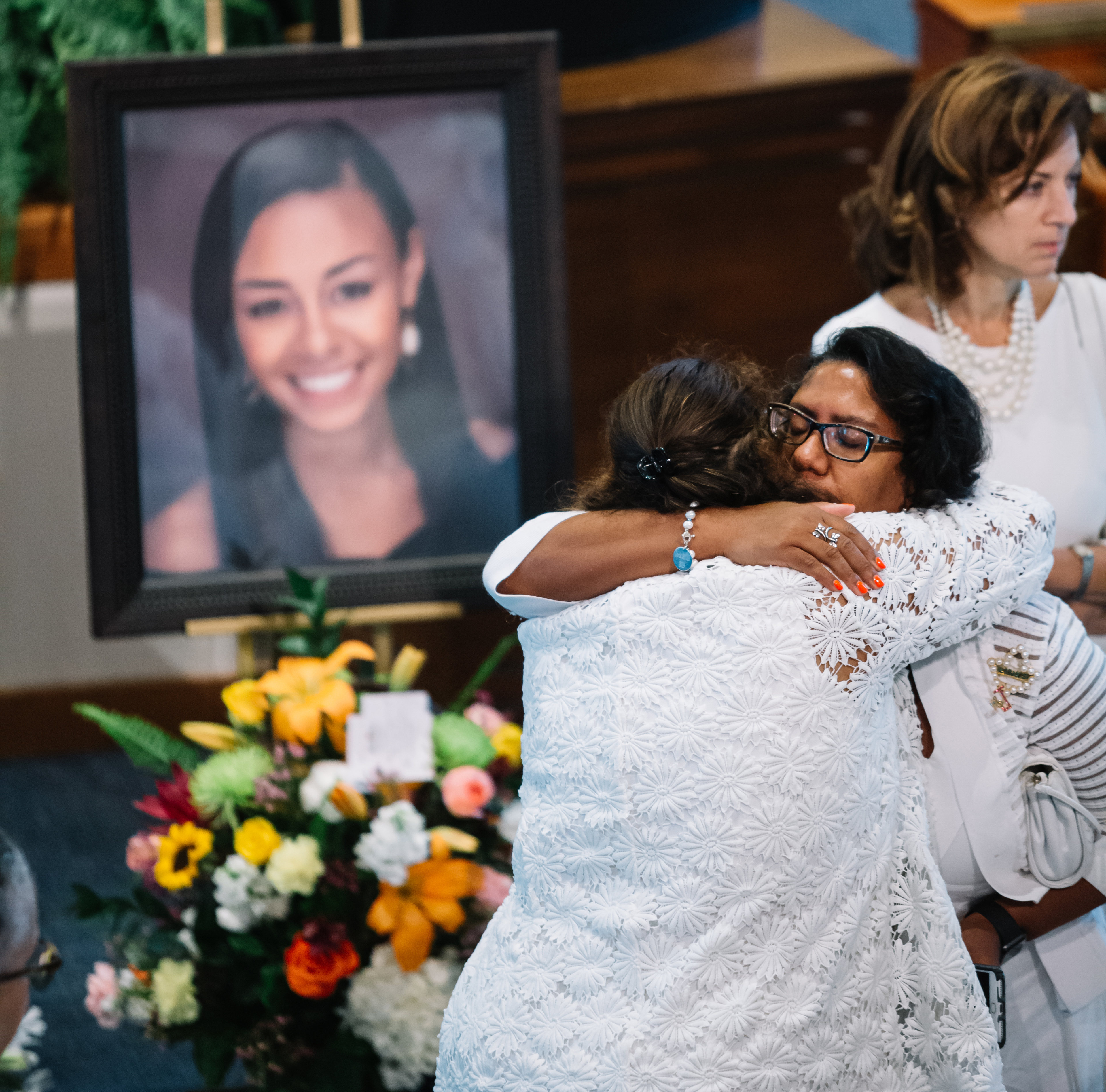 Mourners comforted each other at a memorial for BU student Erin Edwards, her brother, and mother.
