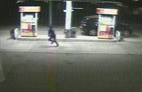 Dun Meng is pictured escaping from his carjacked Mercedes in an image from a video surveillance camera at a Shell gas station.