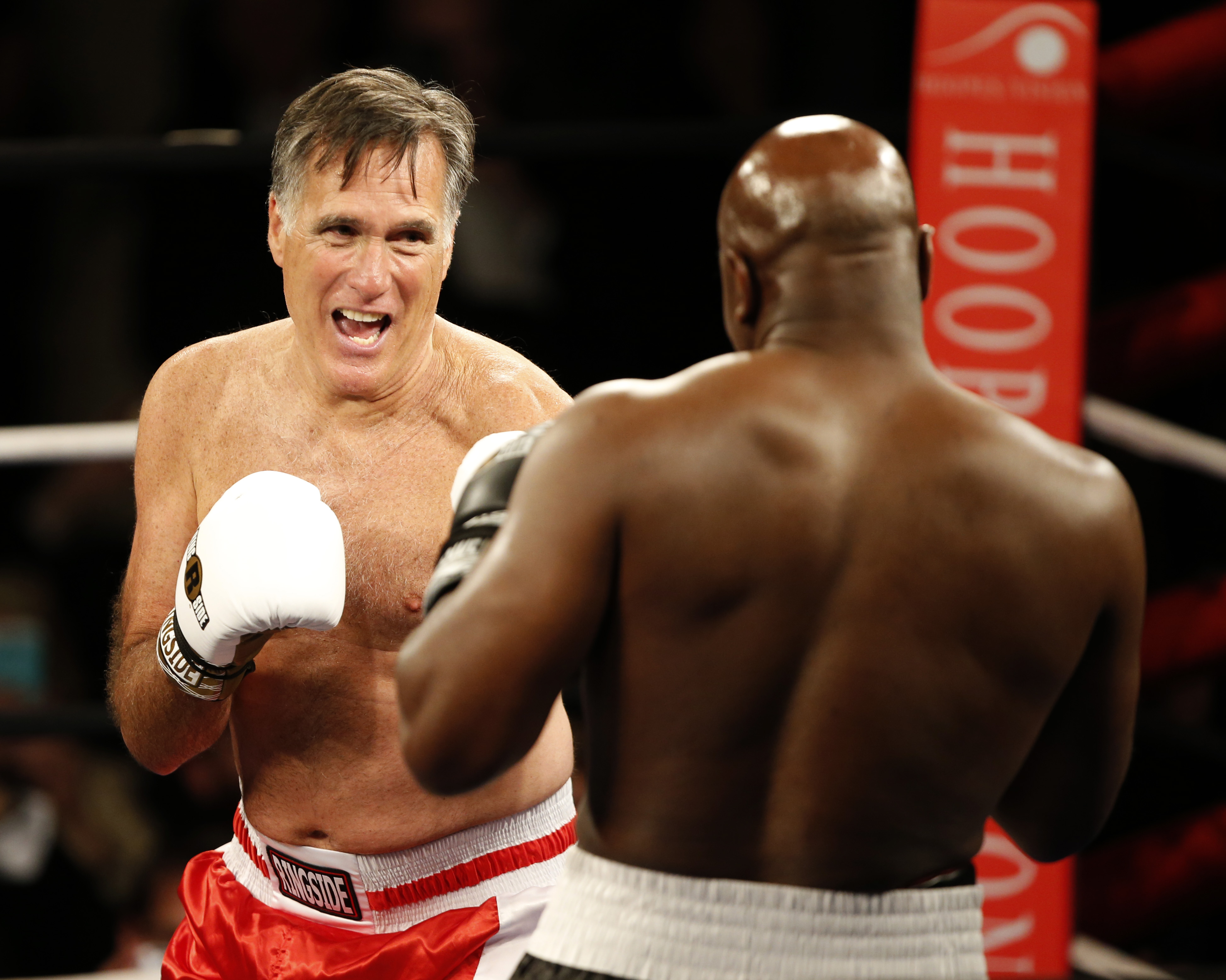 Mitt Romney and Evander Holyfield faced off in Salt Lake City May 15.
