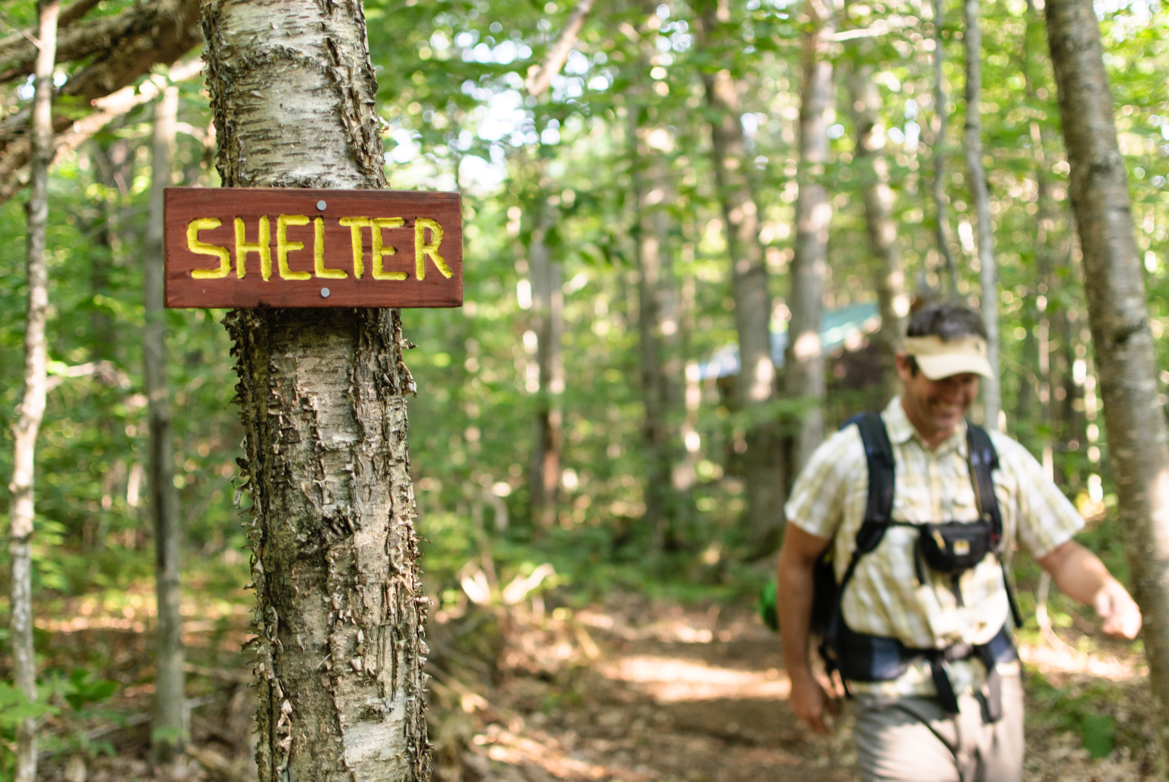 Paul Clifford, 46, of Portland, Maine, hikes out from Old Hermit Shelter, built in June in Nash Stream Forest by Cohos Trail volunteers.