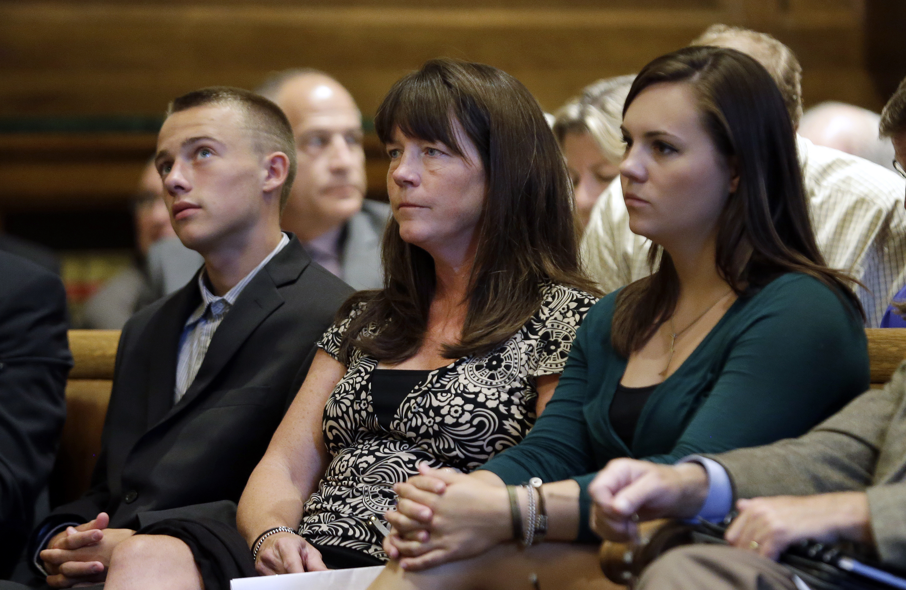 Plaintiff Stephanie McCleary (center) sat with her children Kelsey (right) and Carter during a hearing before the state Supreme Court.