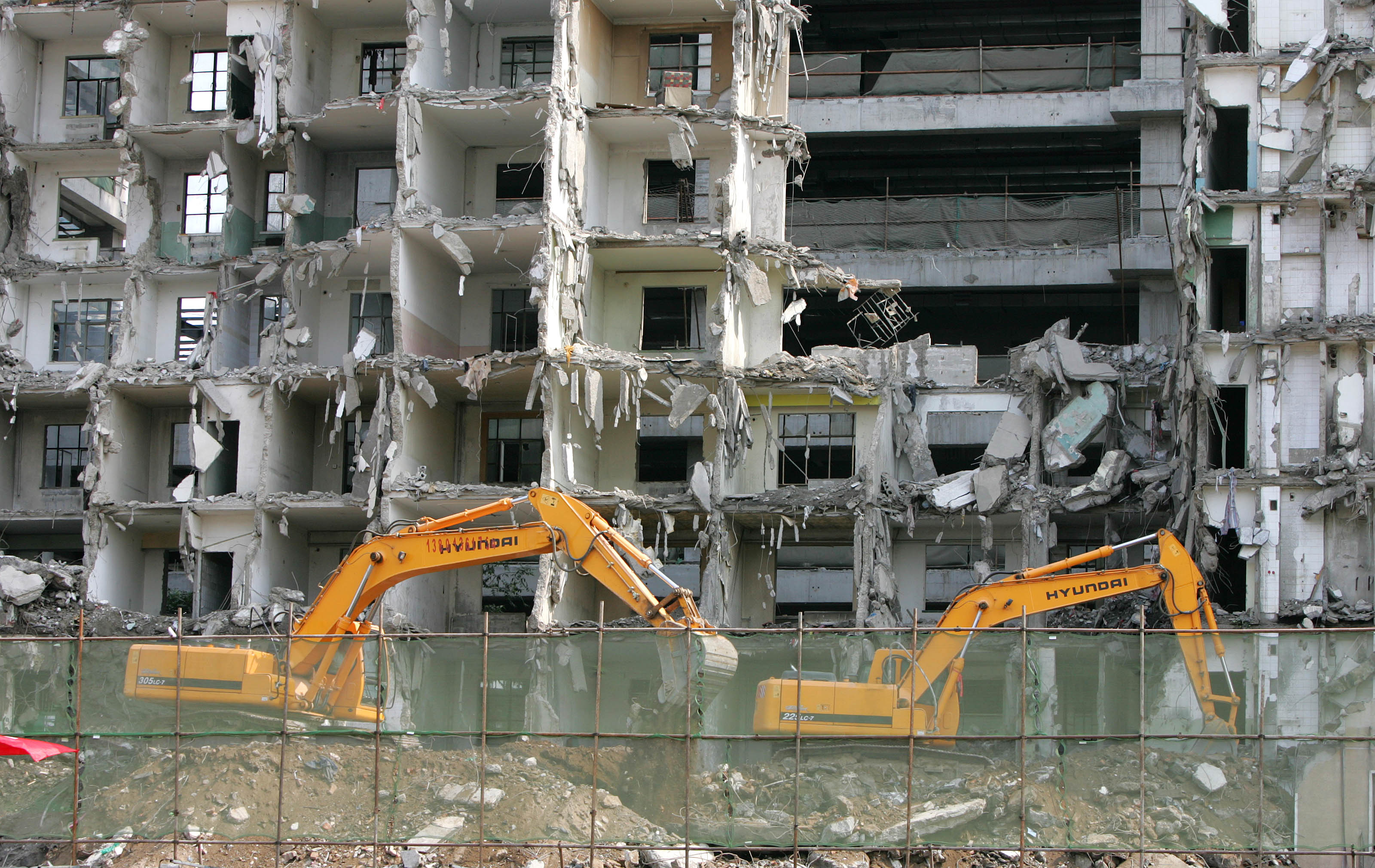 An older apartment building in Beijing was demolished in June 2007, a year before the Summer Olympics came to China, to make way for a new commercial development.