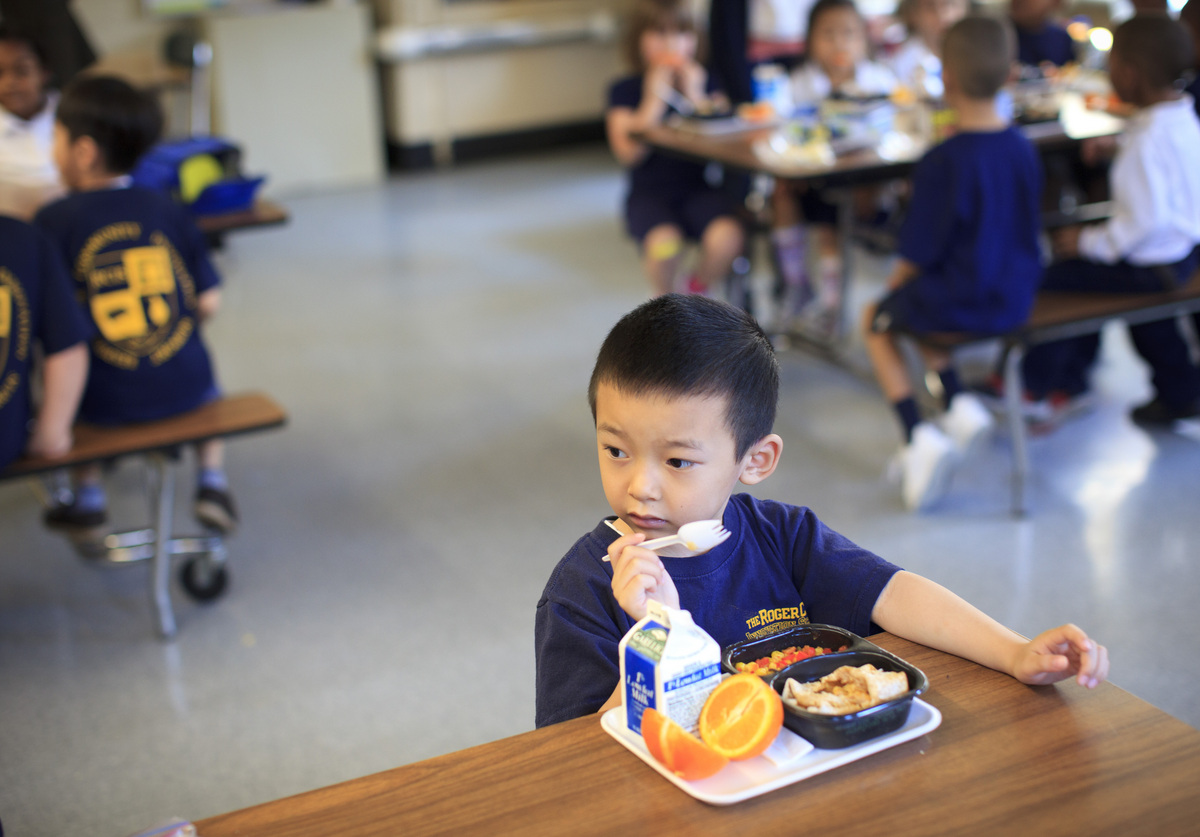 Trac Dzuong ate tacos, vegetables, and an orange in school. A food vendor says the city did an unfair deal with a rival bidder.