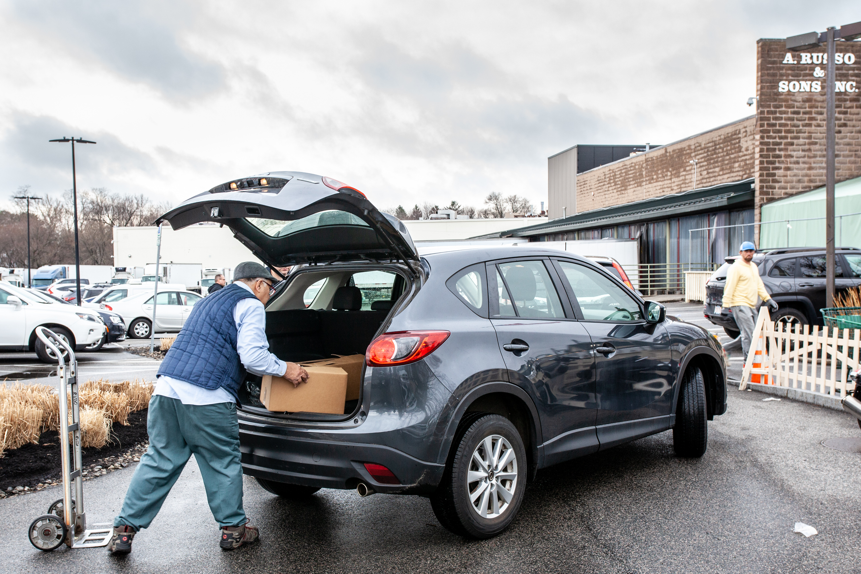 Boxes of food are loaded into cars at Russo's.