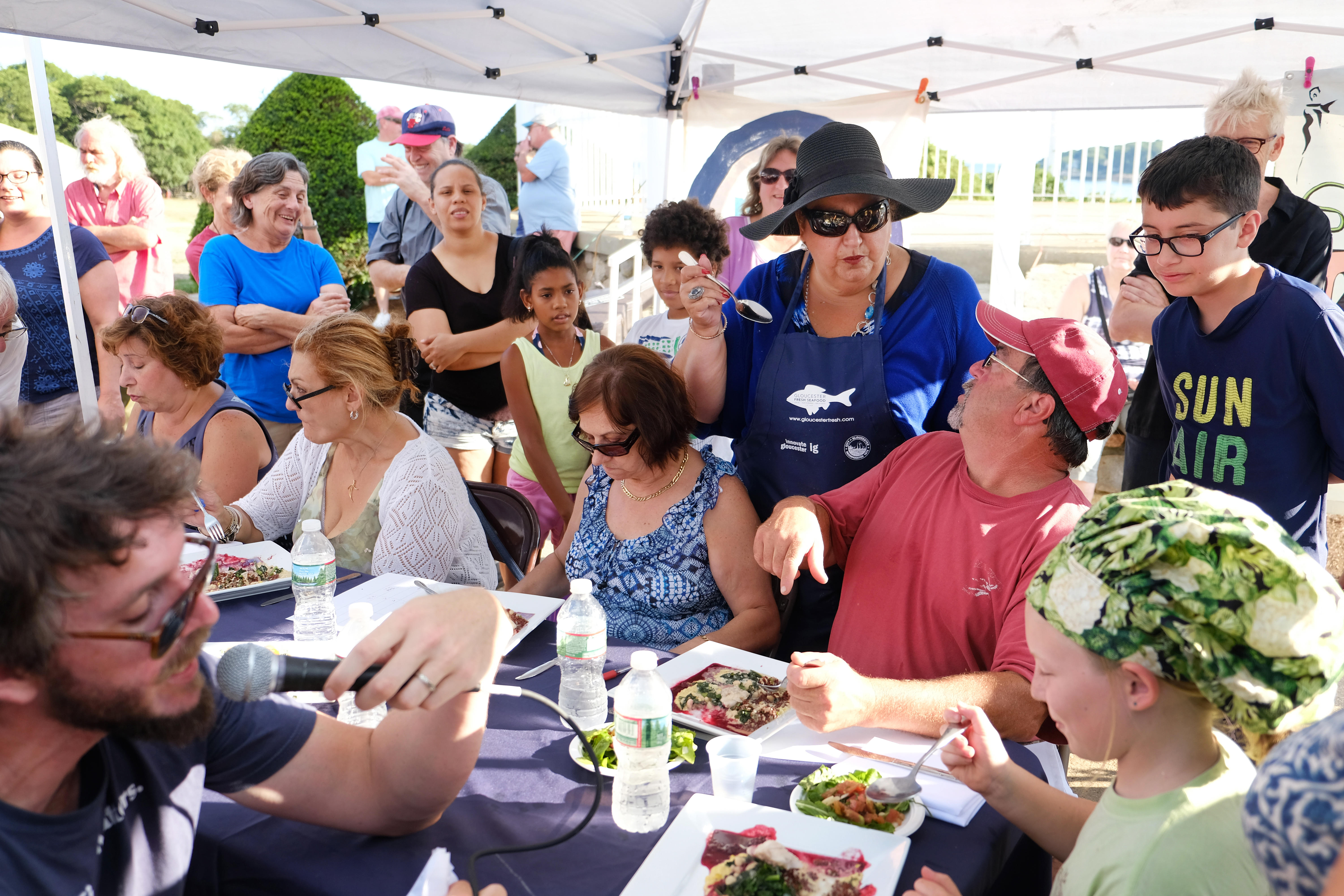Mayor Sefatia Romeo Theken mingles as everyone digs in at the Seafood Throwdown in Gloucester.