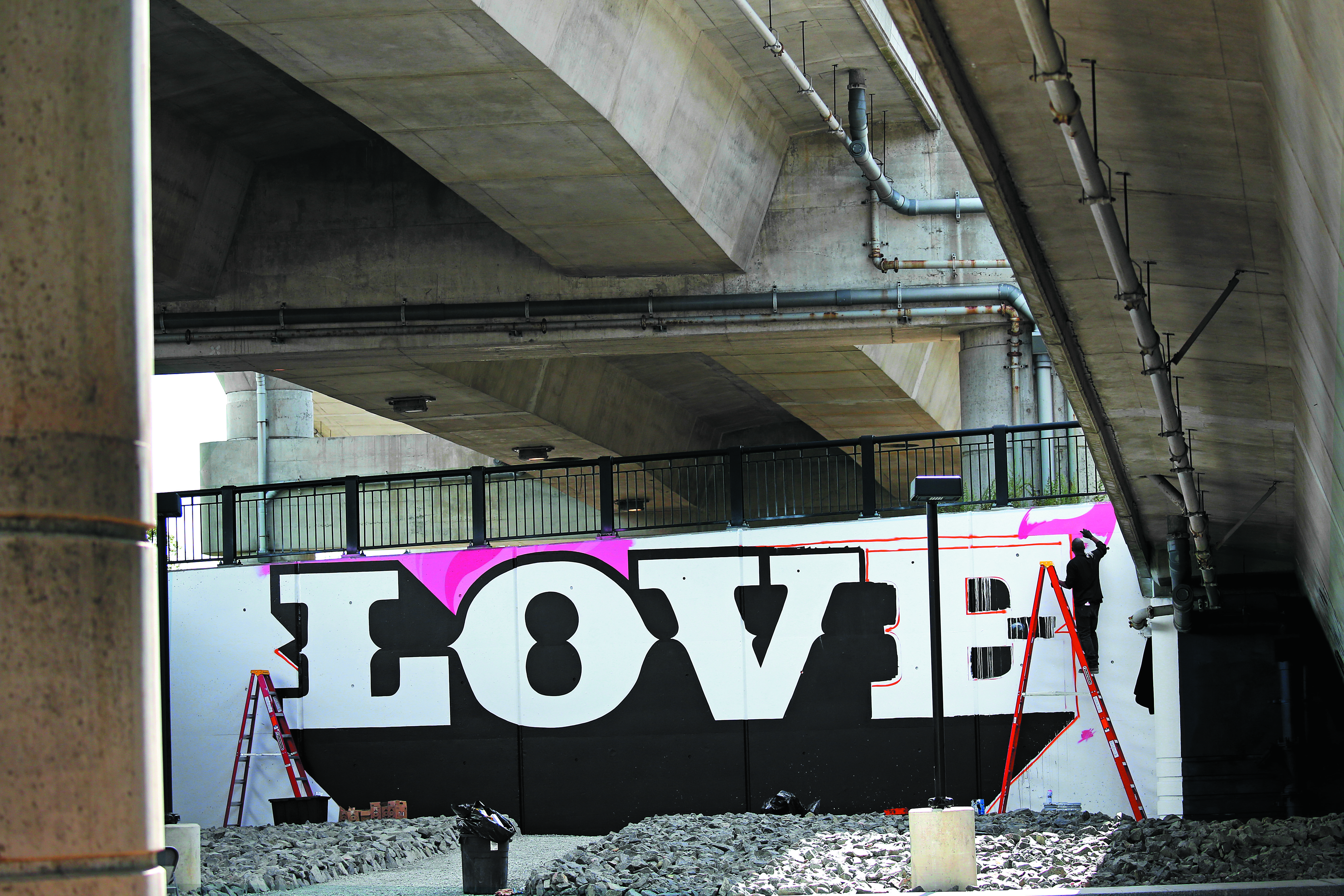 Artist Cey Adams worked on LOVE at "Ink Underground," a park being designed under the Southeast Expressway in the South End.