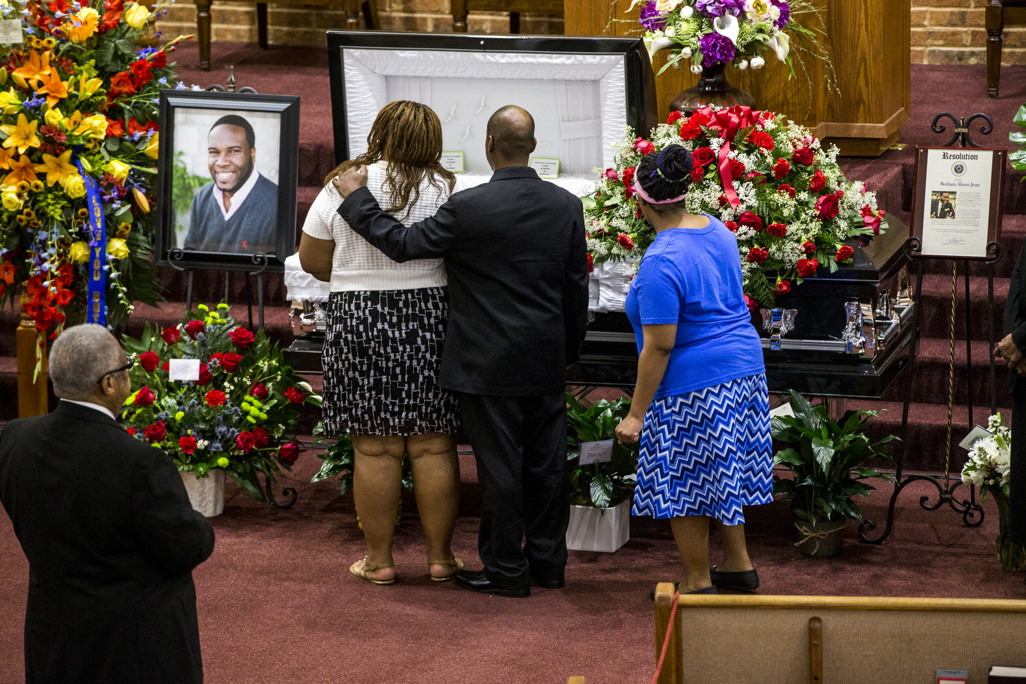 Mourners consoled each other during the public viewing before the funeral of Botham Shem Jean at the Greenville Avenue Church of Christ in Richardson, Texas. He was shot and killed by a Dallas police officer in his apartment in Dallas.