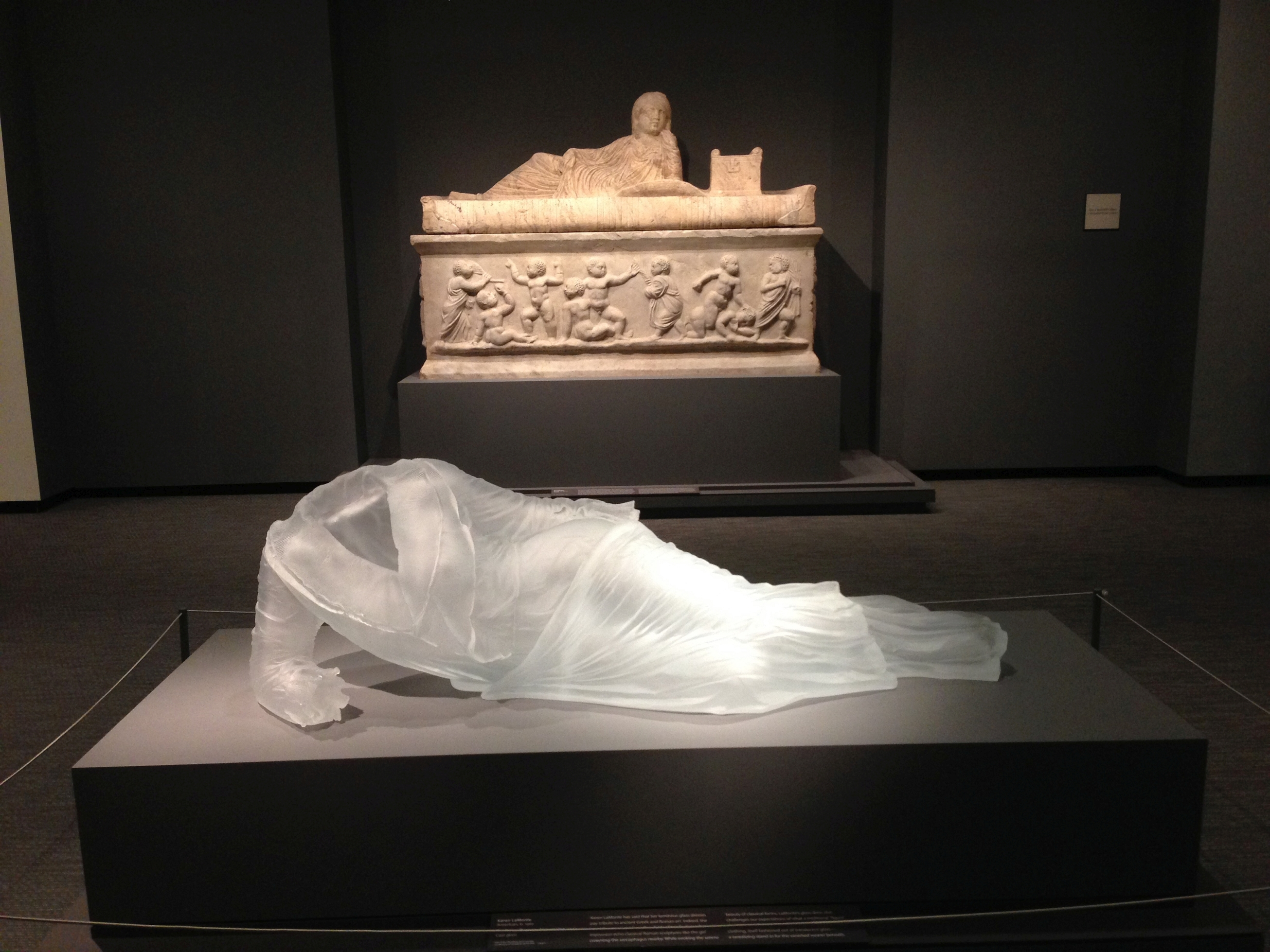 Karen LaMonte's (cq) translucent cast-glass dress, "Reclining Drapery Impression," at the Chrysler Museum of Art.