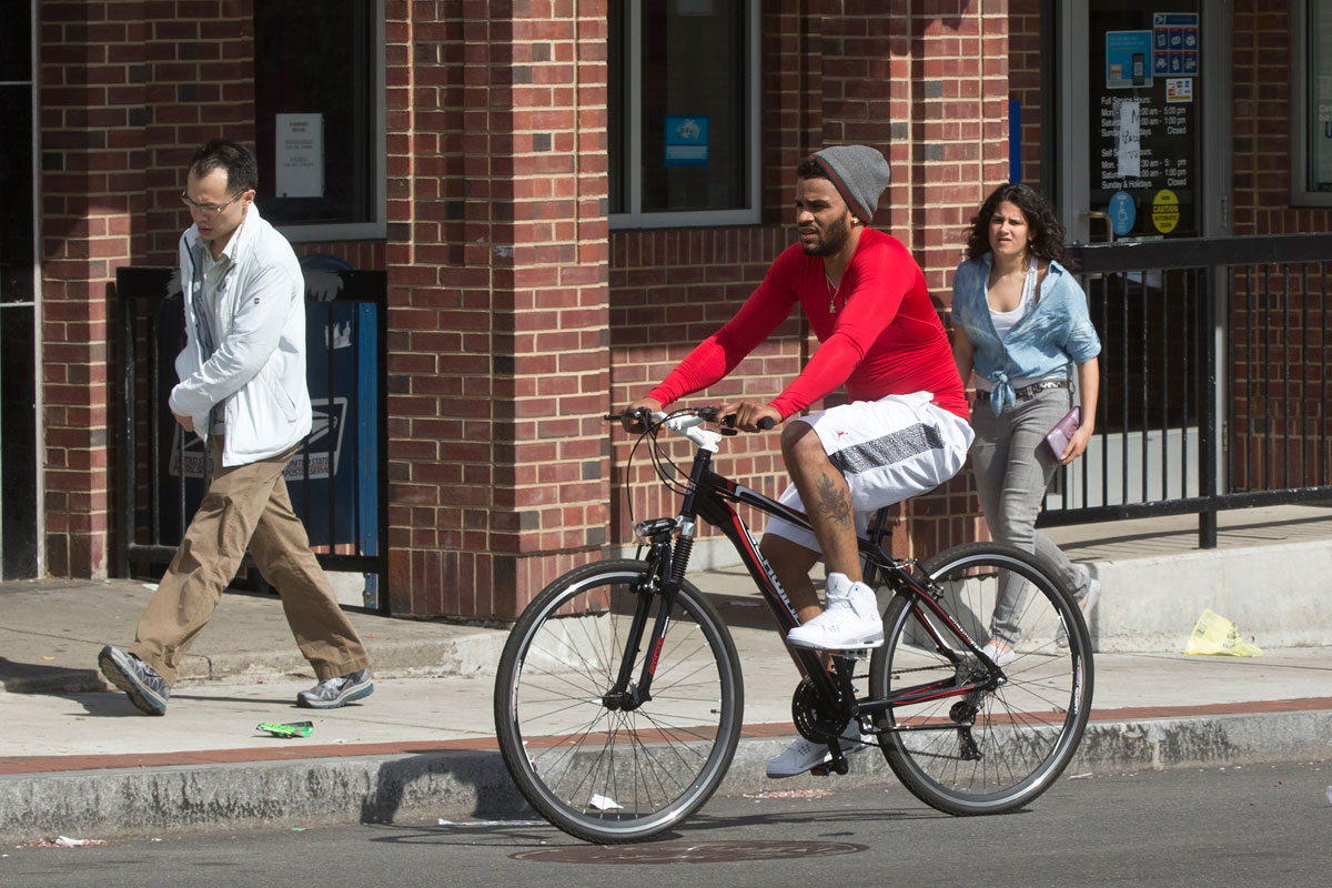 Leaving work, Rudolfo Chalas, 27, pedaled down Adams Street near Dorchester Avenue.