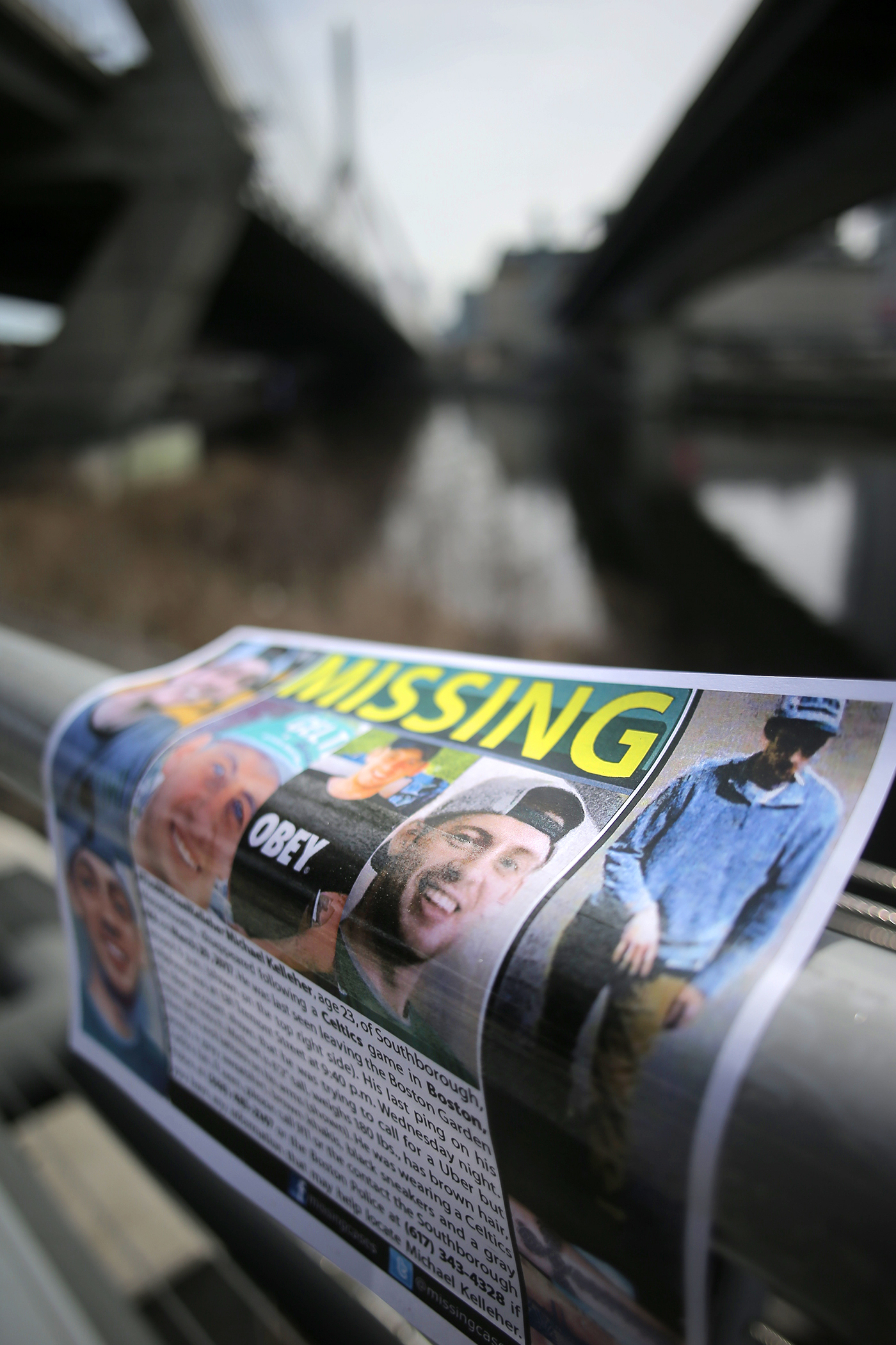 A flyer near the Zakim Bridge asks for information about Michael Kelleher.