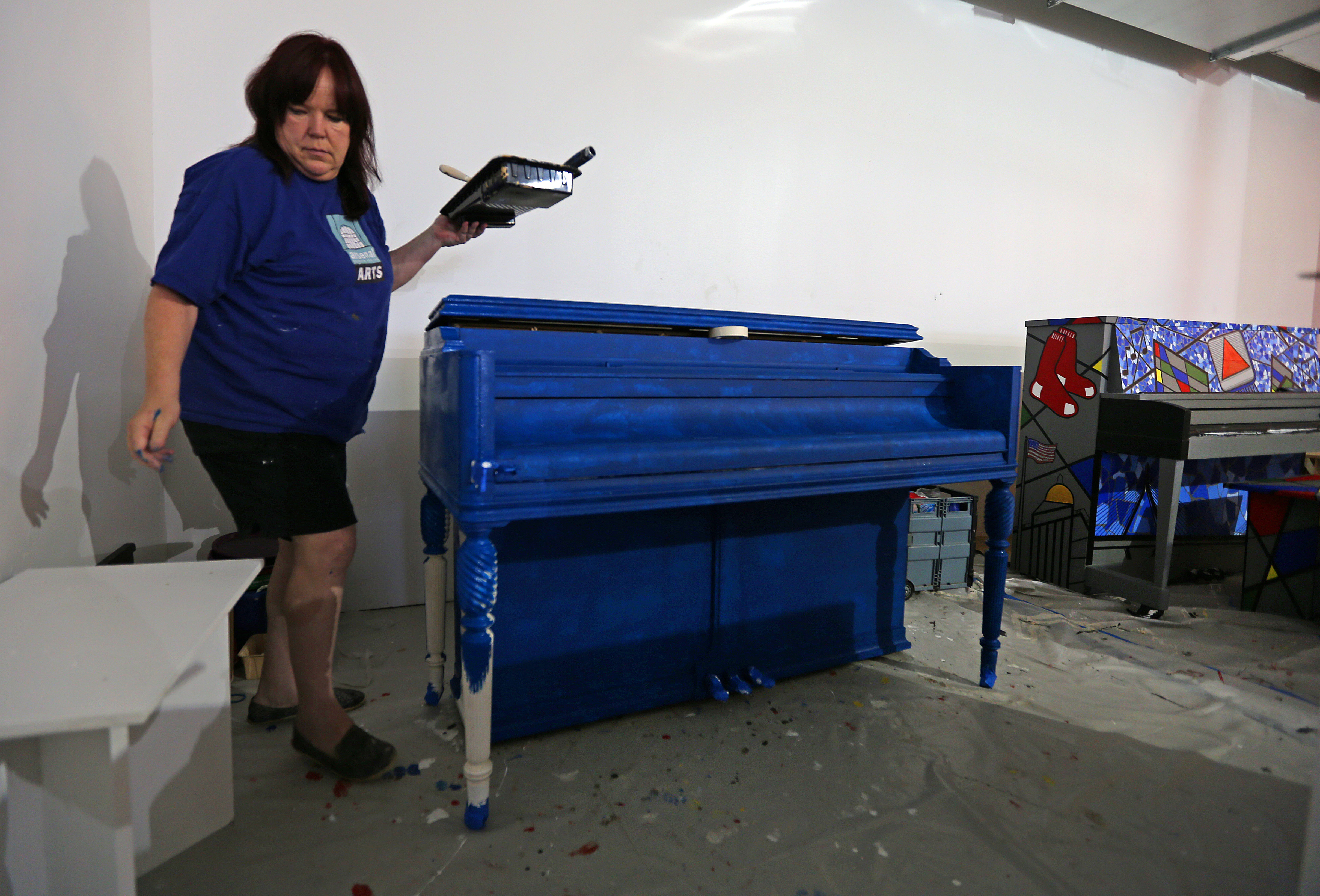 Artist Dawn Evans Scaltreto of Watertown worked on her piano project.