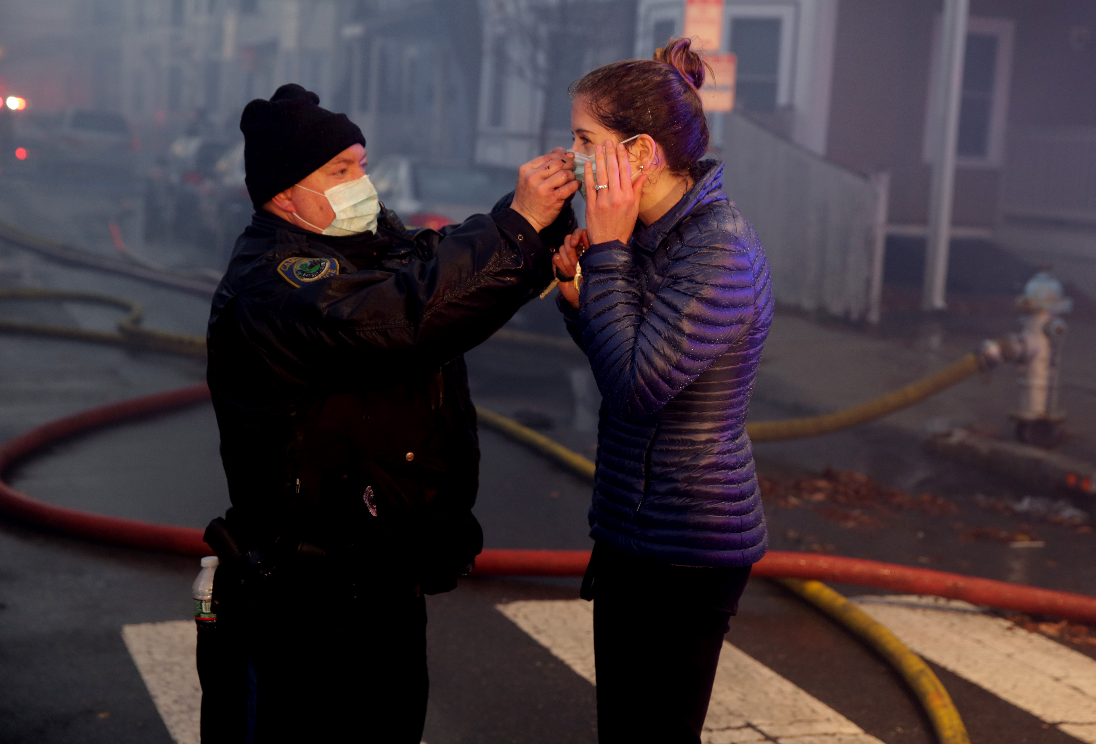A Cambridge police officer helped a woman at the scene.