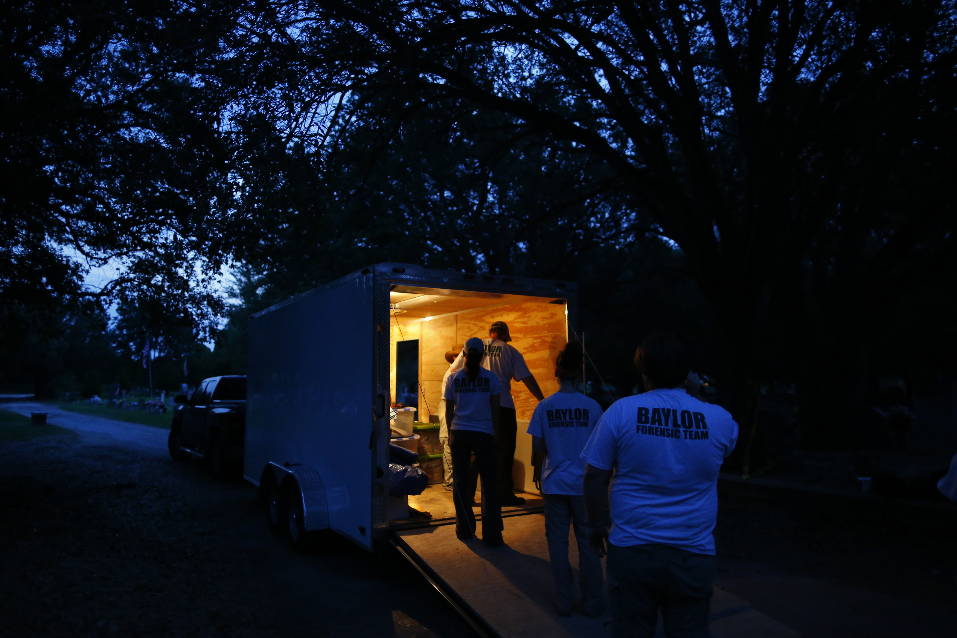 Members of the Baylor team unloaded equipment from their trailer before sunrise.