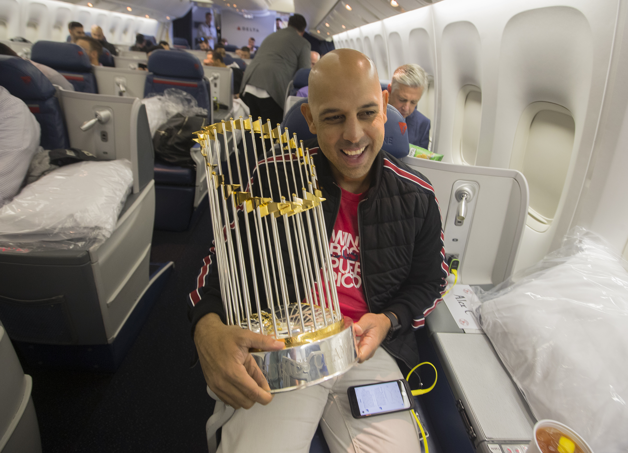 Alex Cora escorted the World Series championship trophy on the Red Sox’ charter flight from LAX to Boston in 2018.