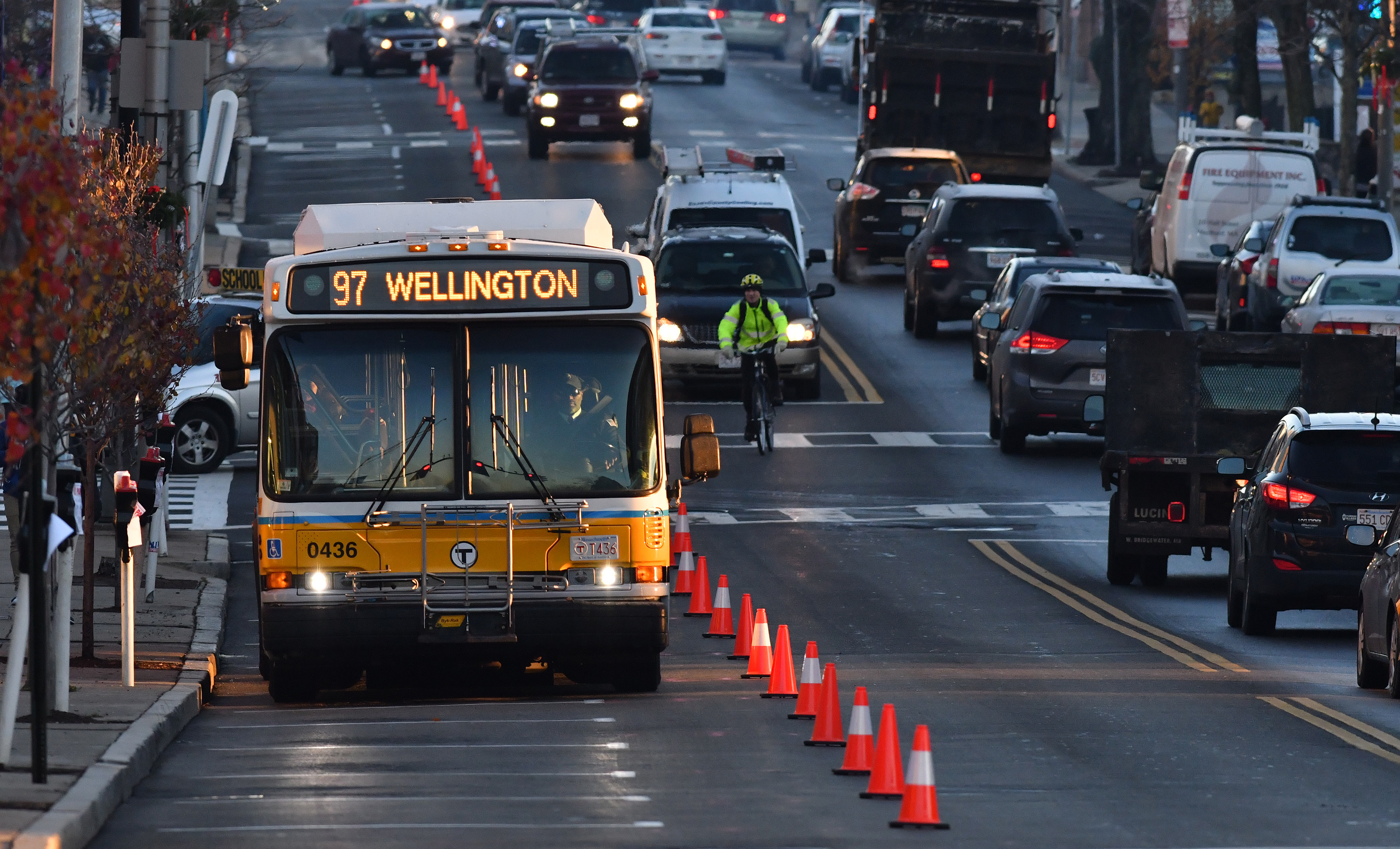 An MBTA bus drove on a dedicated lane converted from parking spaces on Broadway in Everett during a one-week trial.