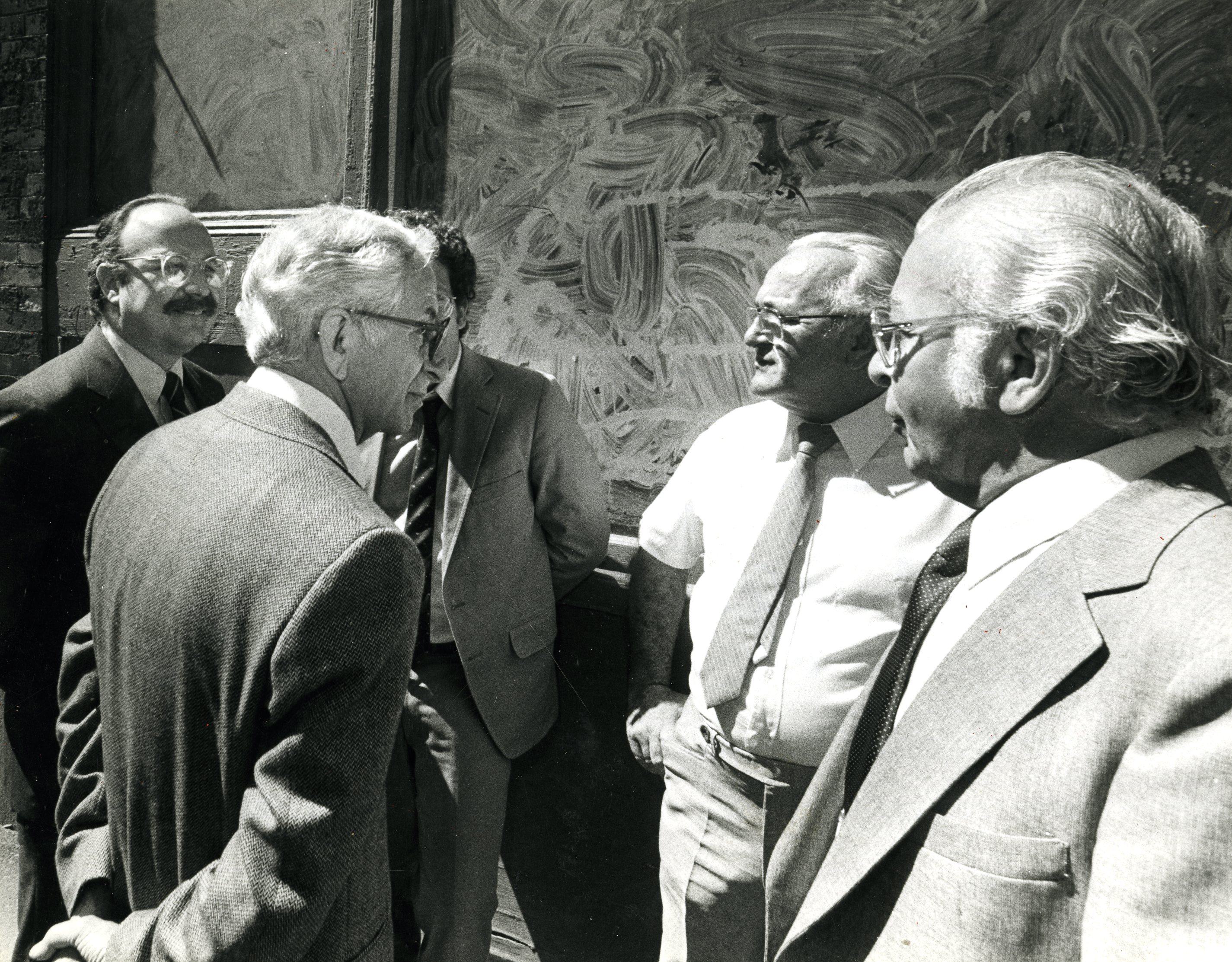 Francesco Angiulo (hand behind back), with brothers Michele (without jacket) and Donato at their Prince Street office.