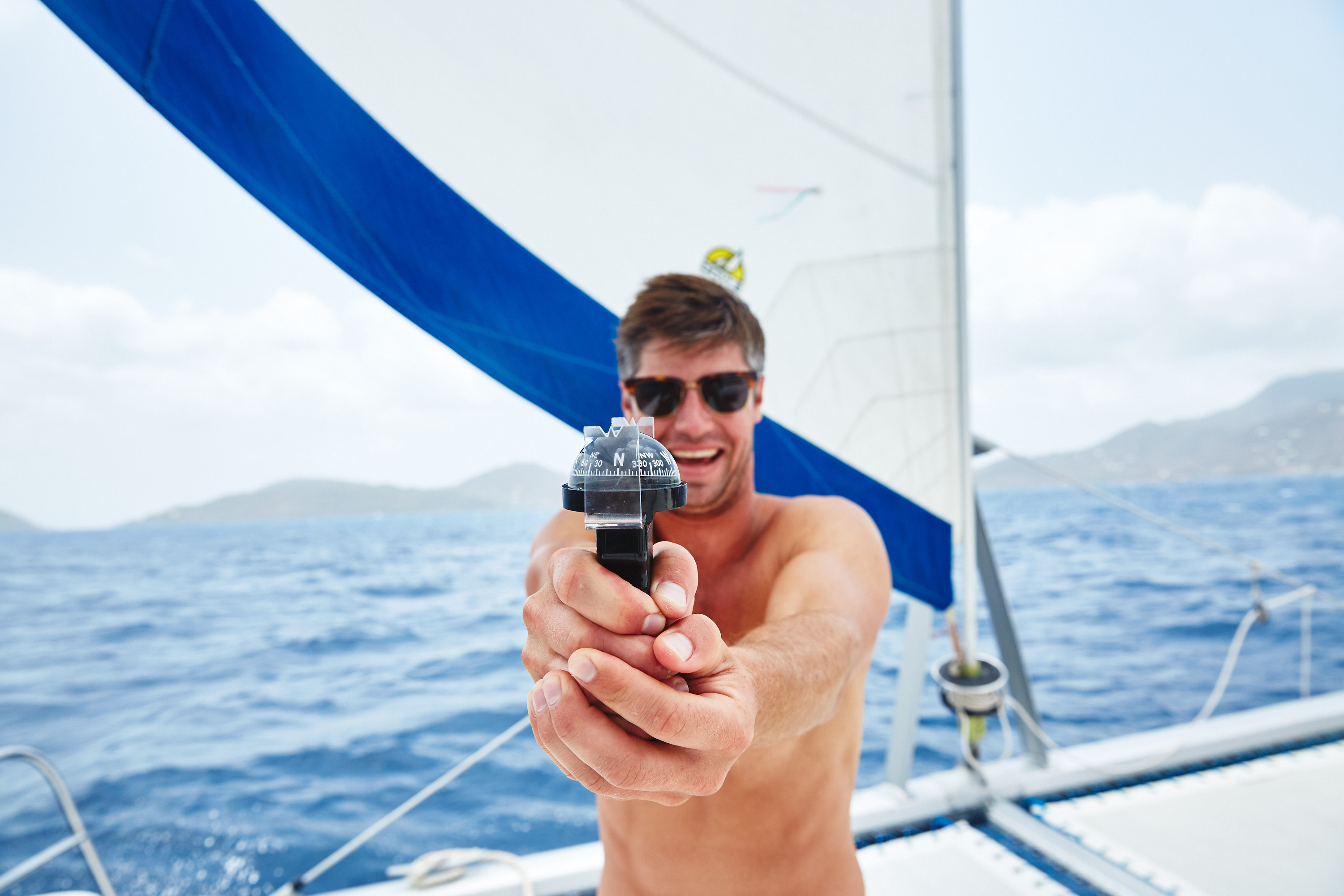 A student with a hand bearing compass.