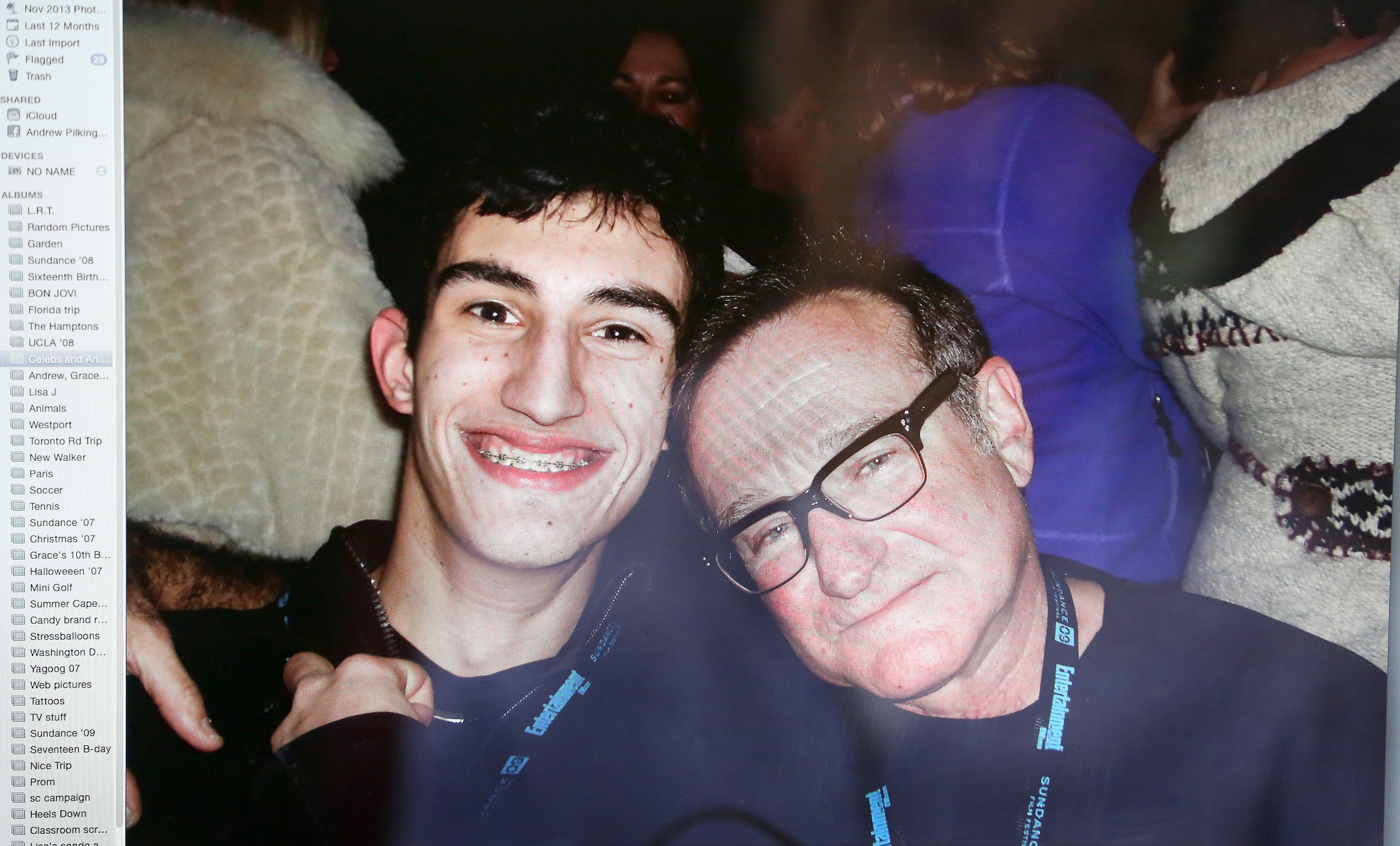 Andrew Pilkington has a collection of photographs of himself with celebrities at the Sundance Film Festival. Here, he poses with Robin Williams.