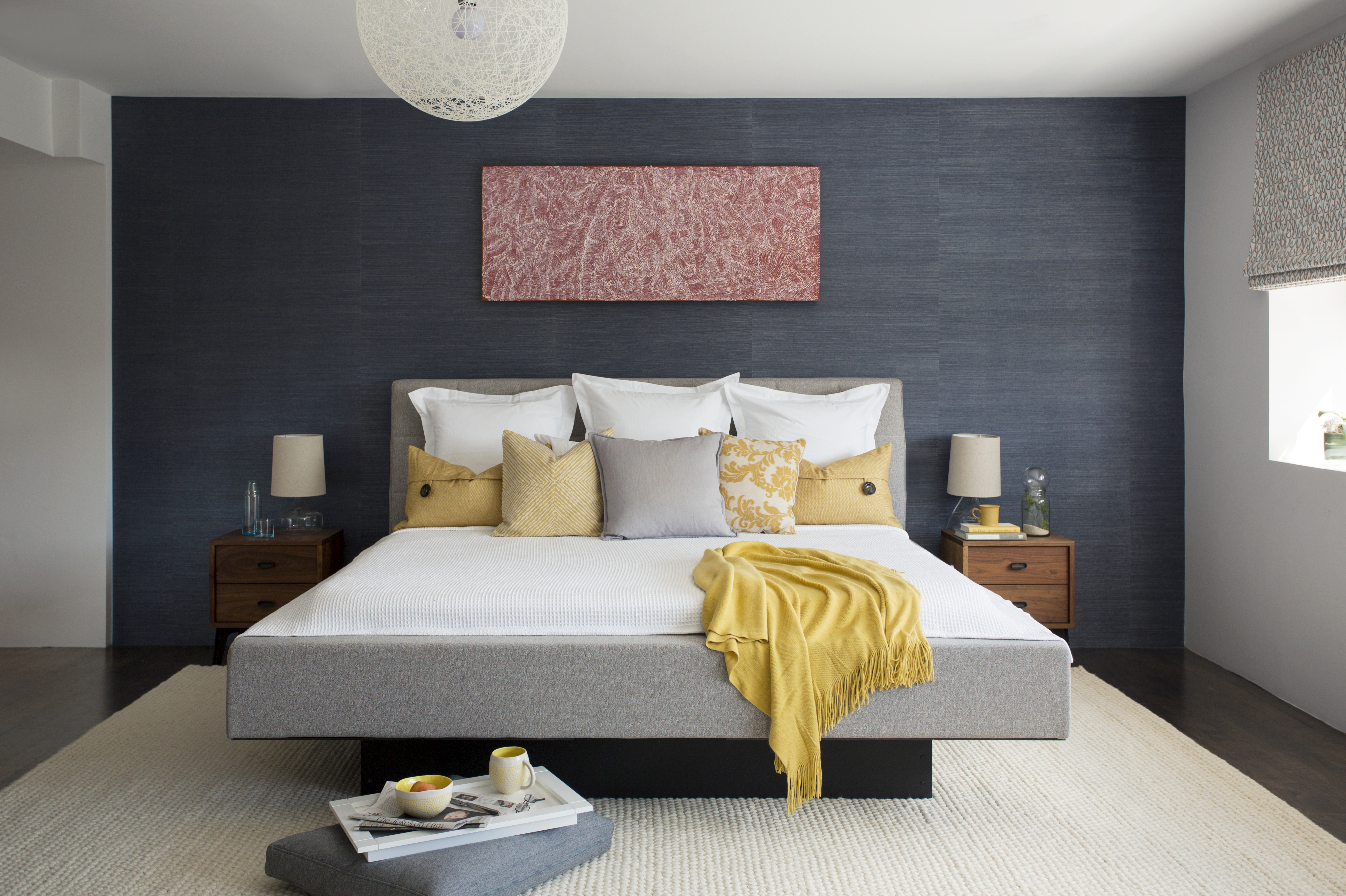 A South End bedroom with a deep-navy hemp paper