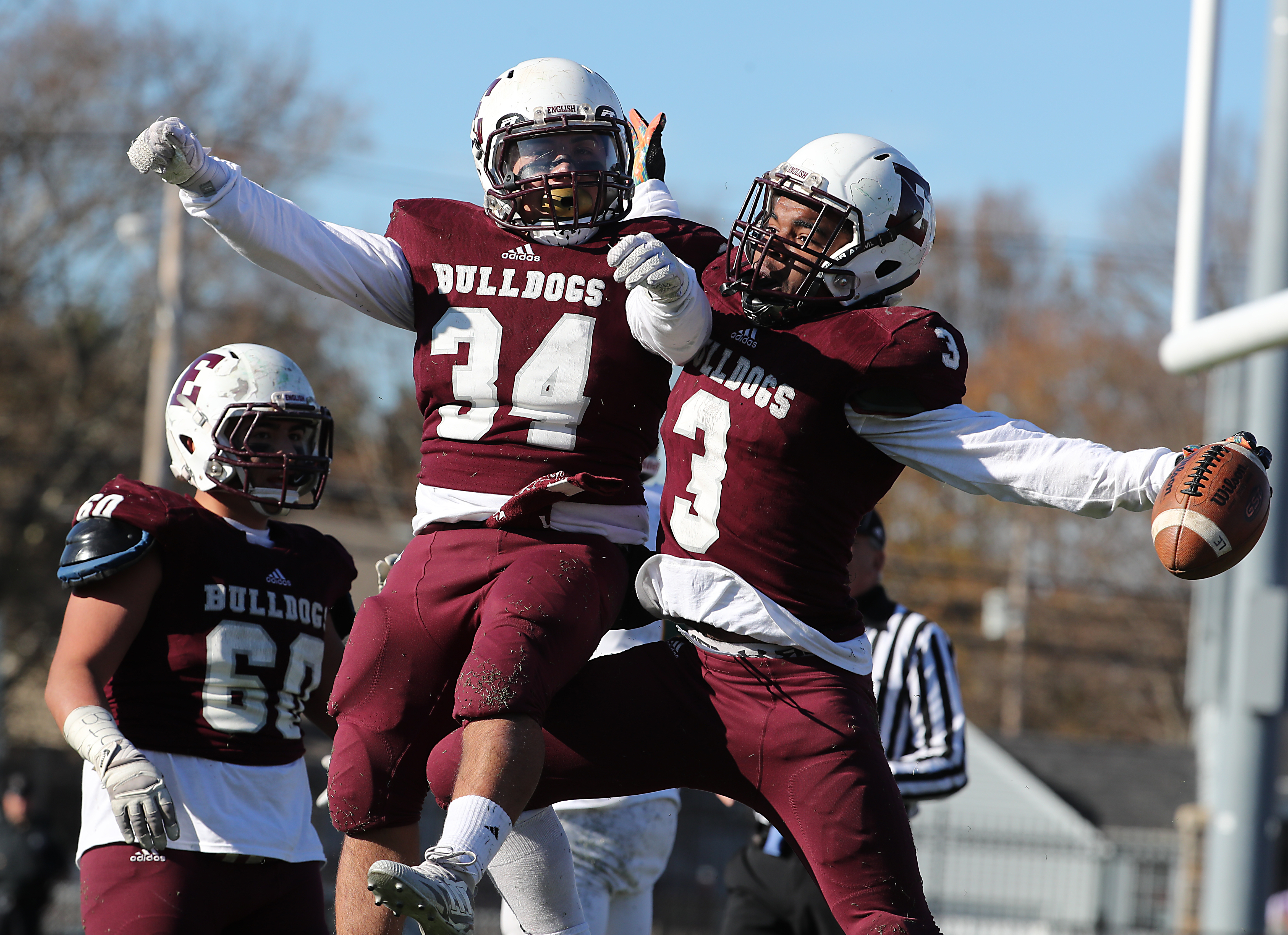 Lynn English’s Ski Gaston (right) celebrates his touchdown reception with Jose Matul.