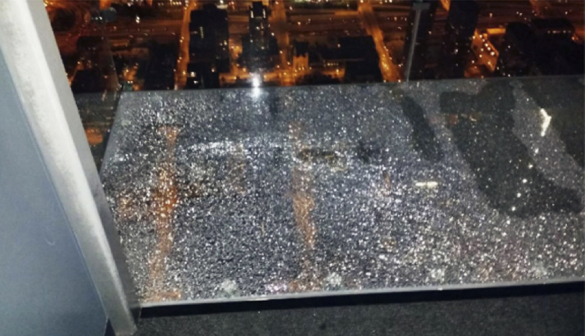 A protective coating covering the glass produced the spider web of cracks.
