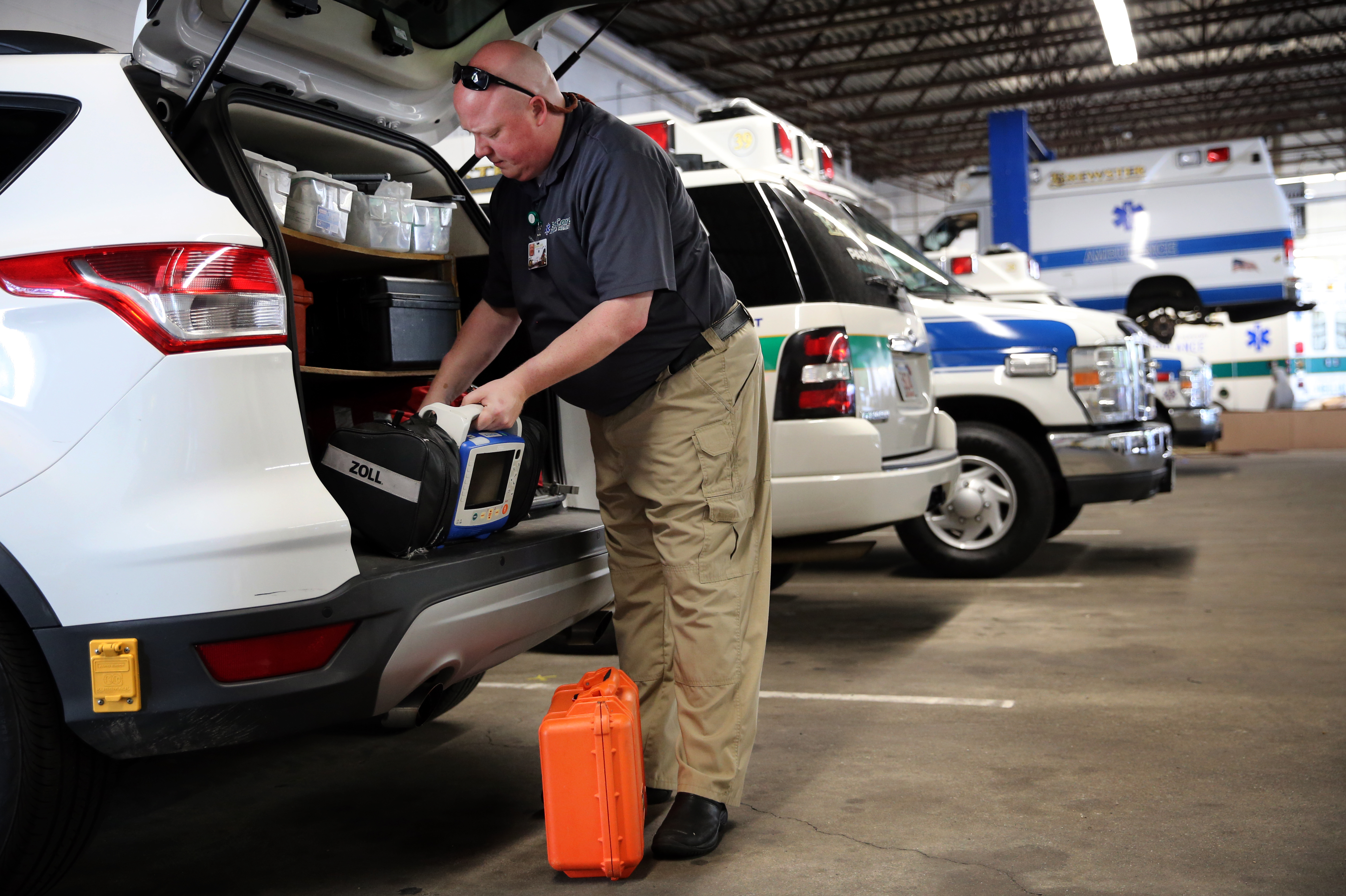 Paramedic Matthew Michaud checked the equipment in his vehicle before going on a call.