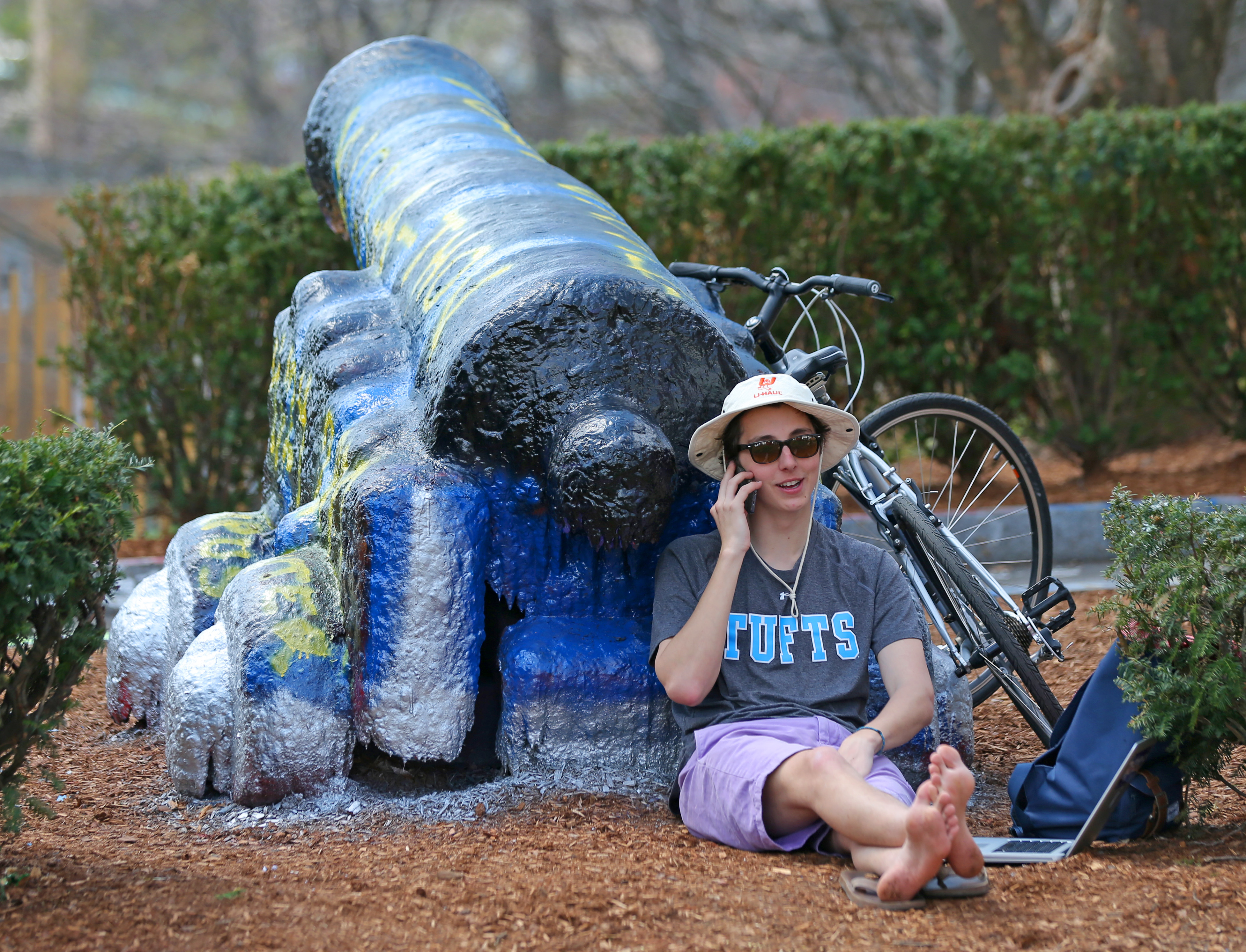 A Tufts University student guarded the campus cannon in April 2015.