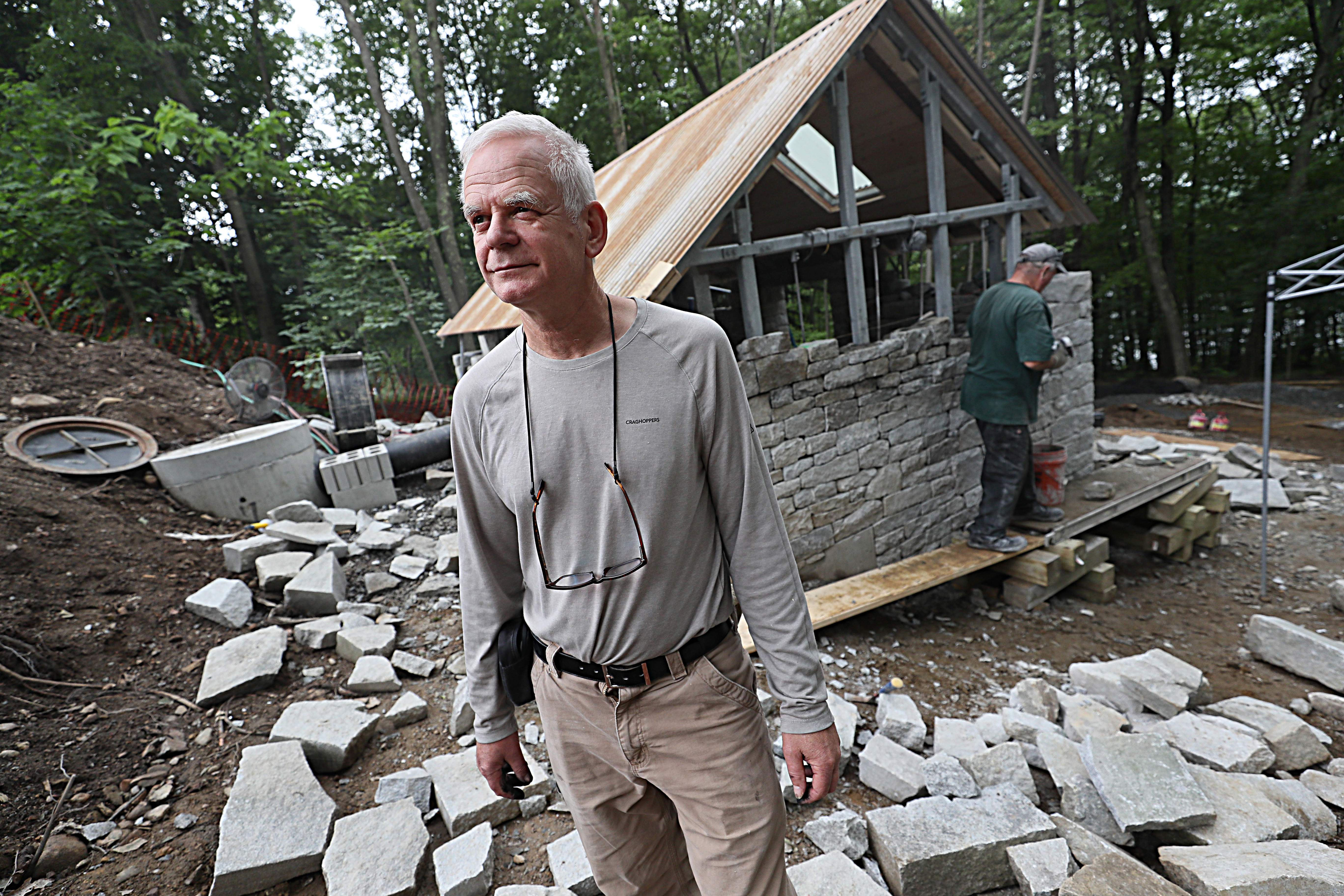 Artist Andy Goldsworthy is shown in 2019 working on an installation at the DeCordova Sculpture Park and Museum in Lincoln.