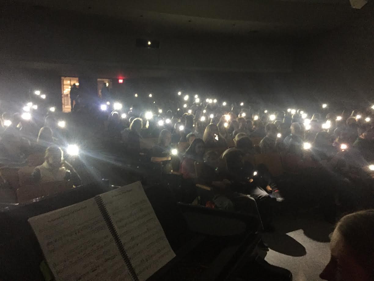 The audience lit the stage with their smartphones when the lights cut out during a middle school play.