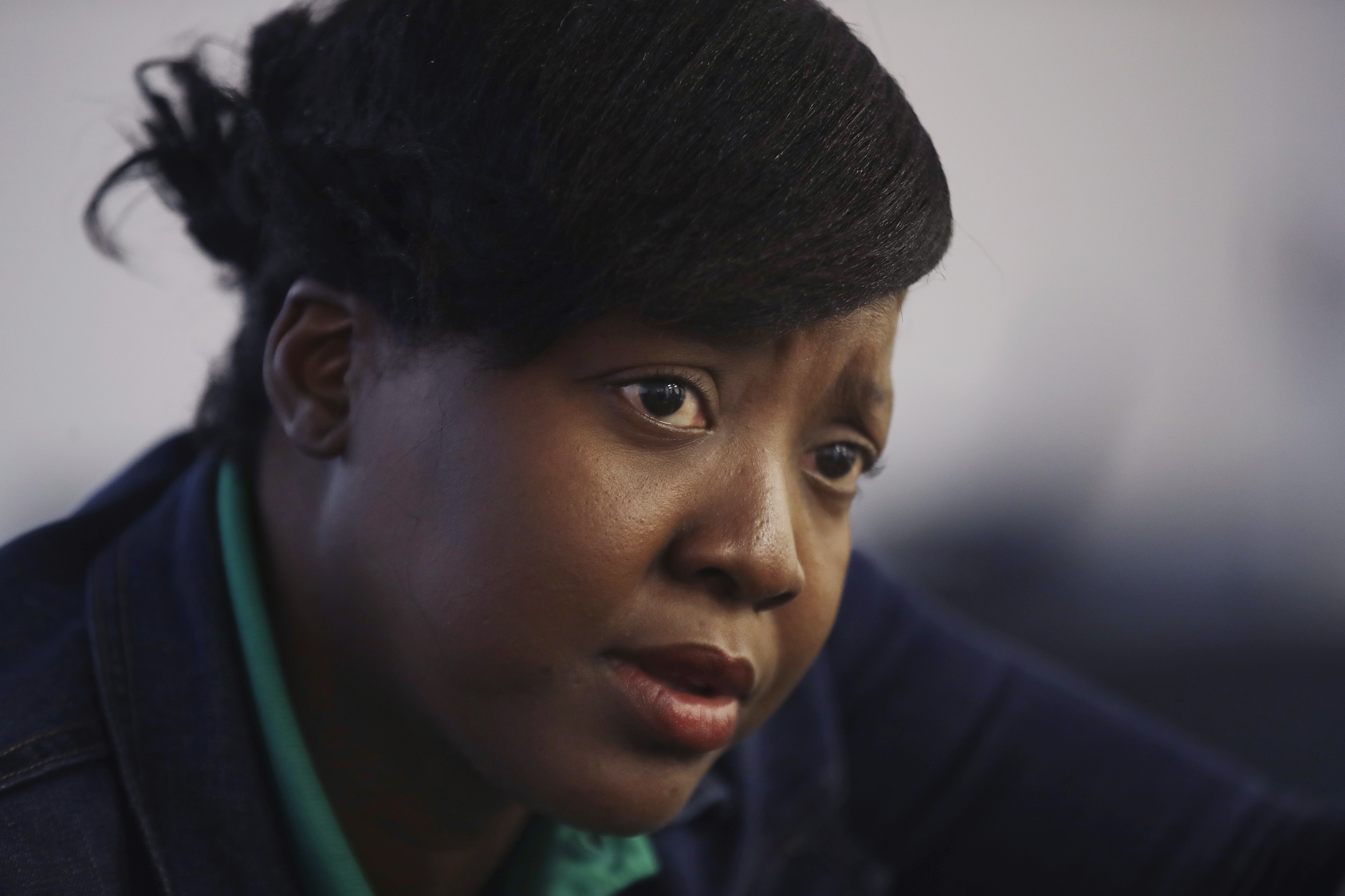 Marie, 35, of Haiti, spoke about seeking treatment in the United States for her 13-year-old sick son during the news conference.