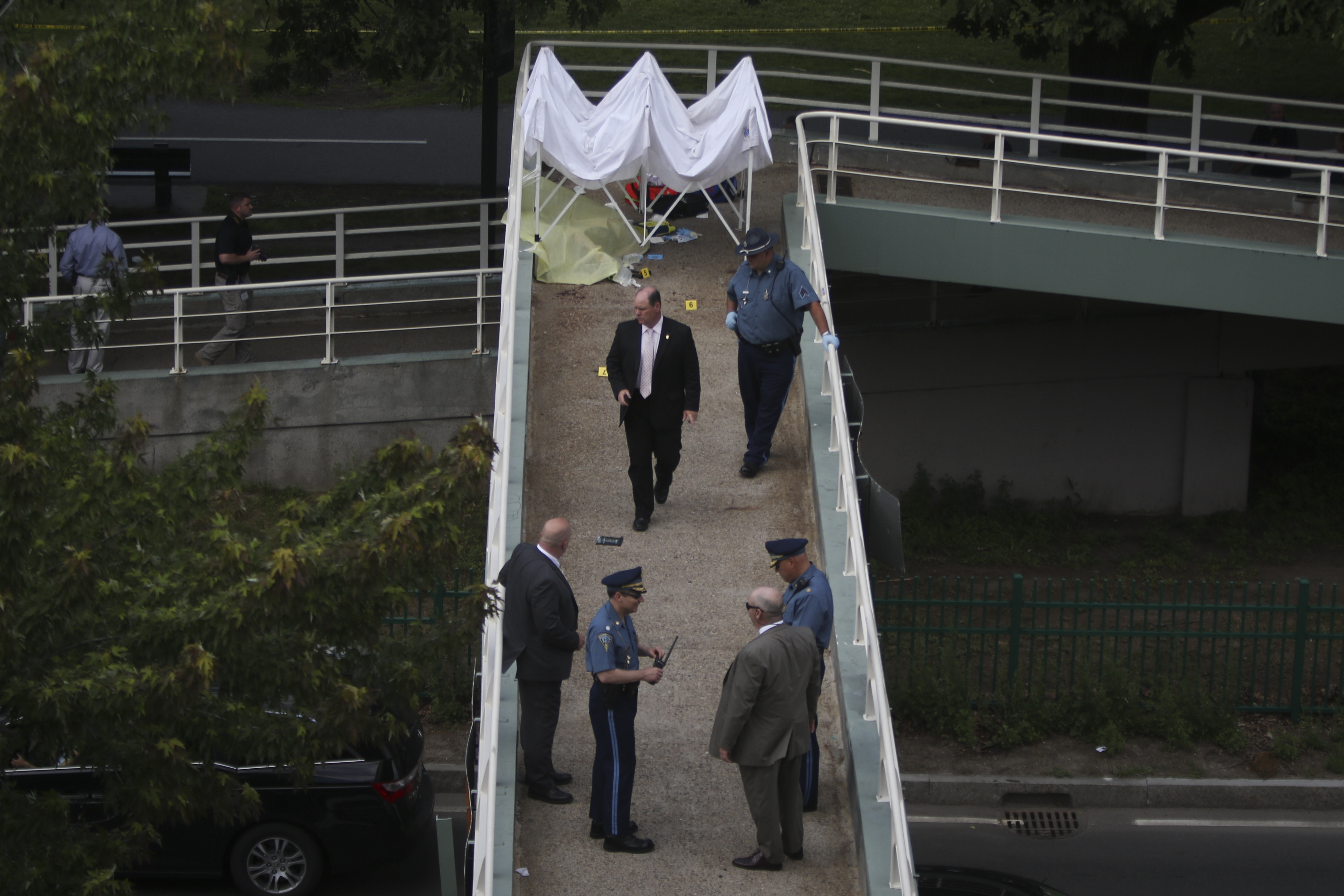 Police investigated the scene where a man was shot by police on the Silber footbridge in Boston.