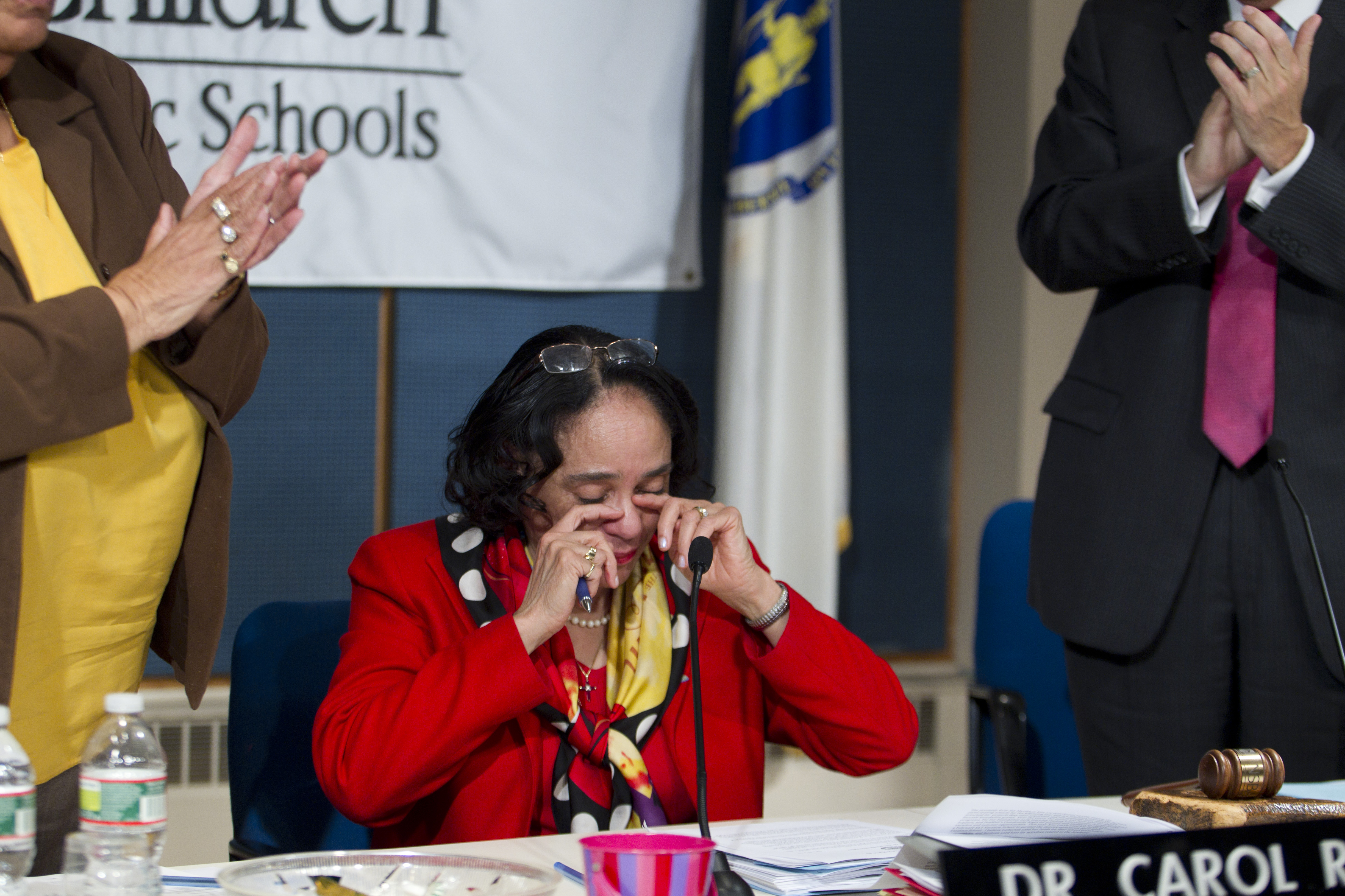 Carol R. Johnson wiped away tears after announcing her plans to retire at a School Committee meeting Wednesday.