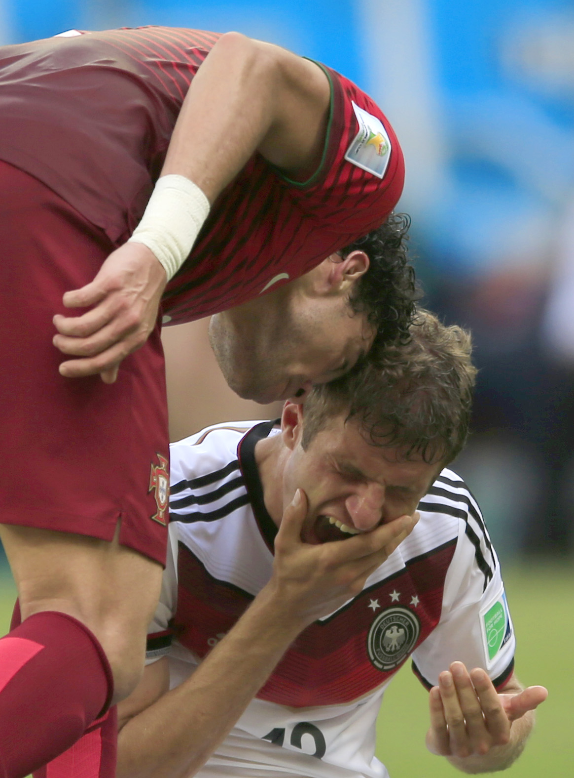 Portugal’s Pepe, left, head-butts Germany’s flopping Thomas Mueller during a match Monday.