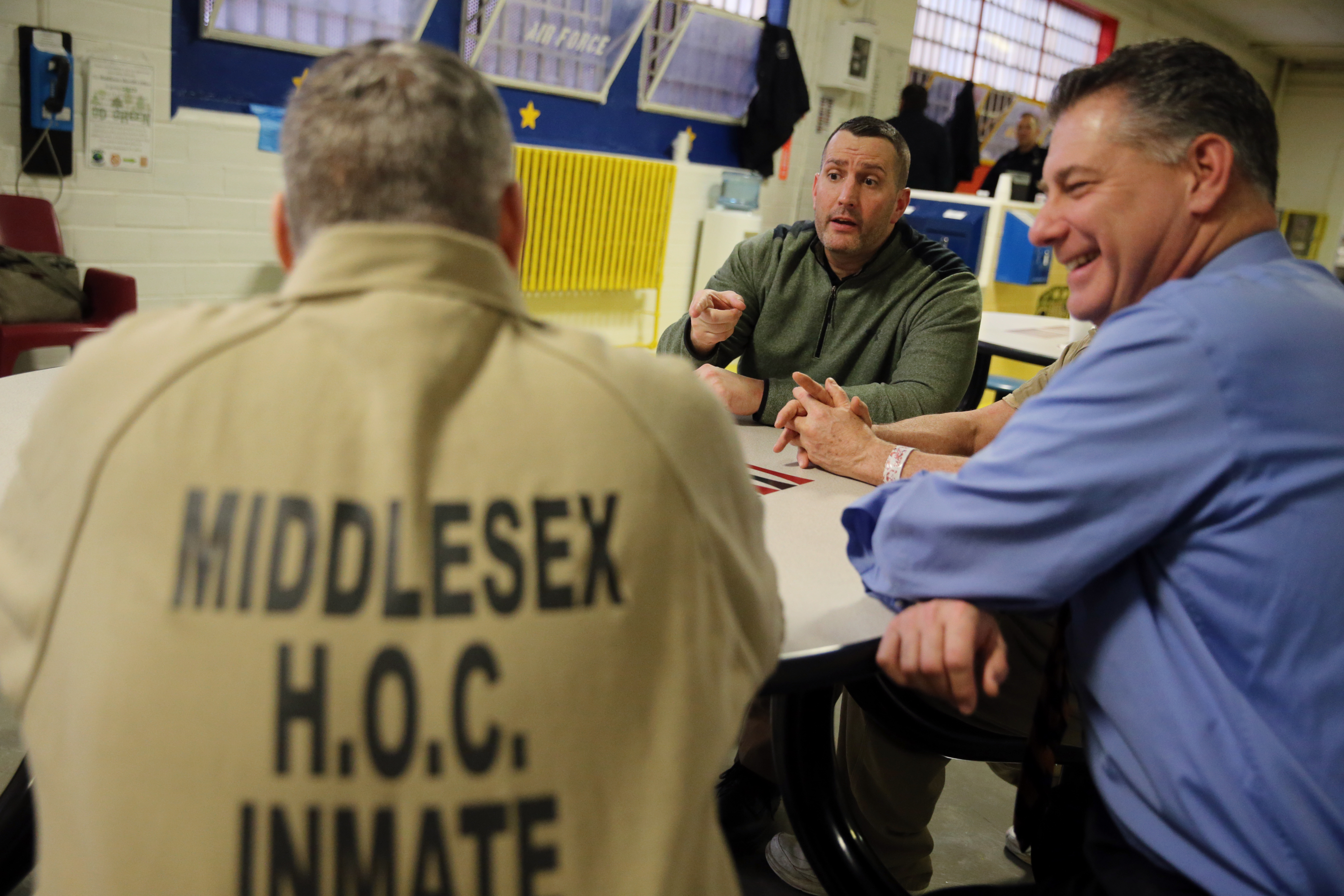 From left: Faherty spoke with Paul Connor, veteran services coordinator, and Middlesex County Sheriff Peter Koutoujian at the jail earlier this month.