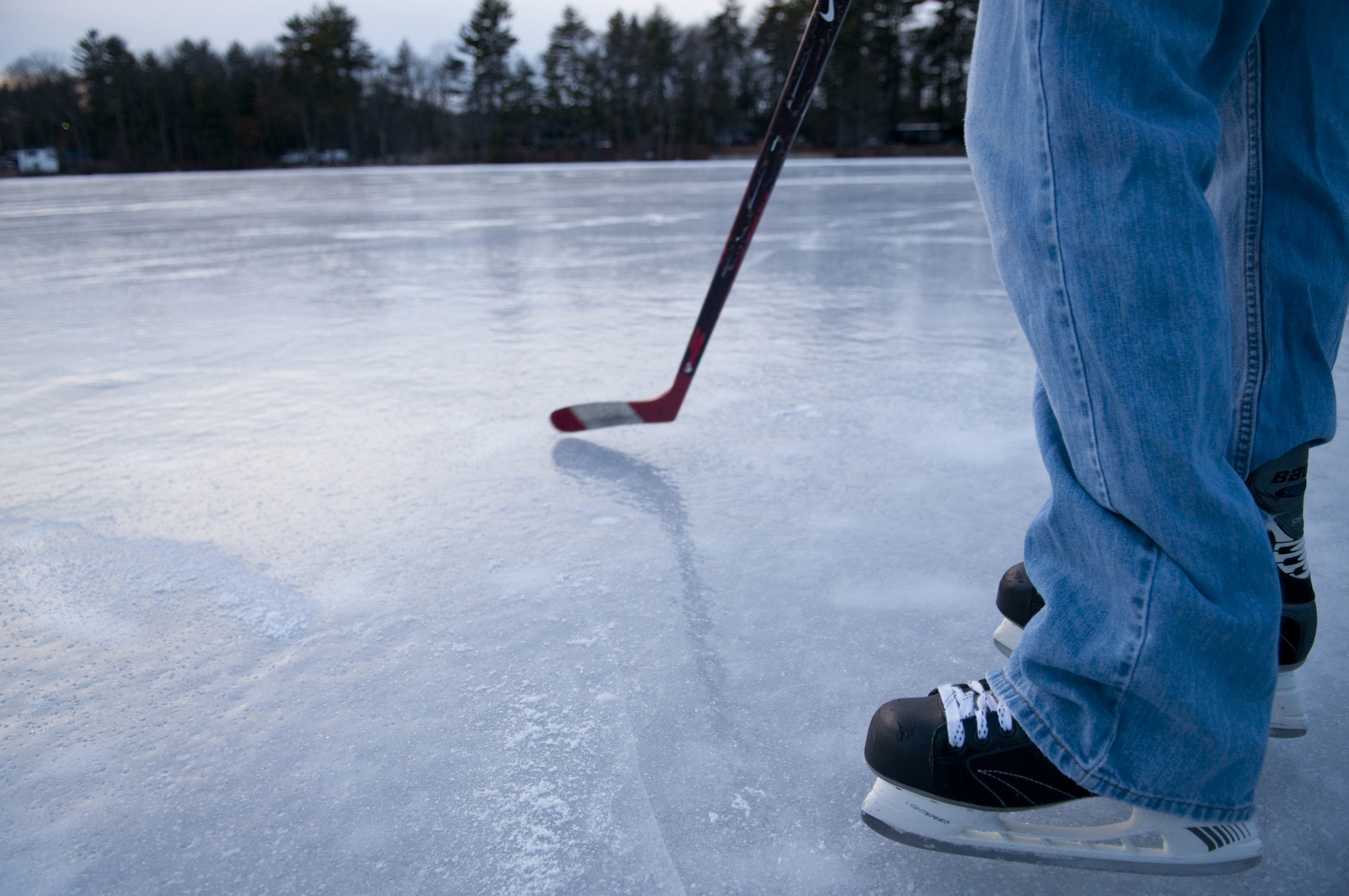 At Phillips Pond a hockey stick is a must, serving as a probe to test discolored patches of ice as well as a necessary piece of pond hockey equipment.