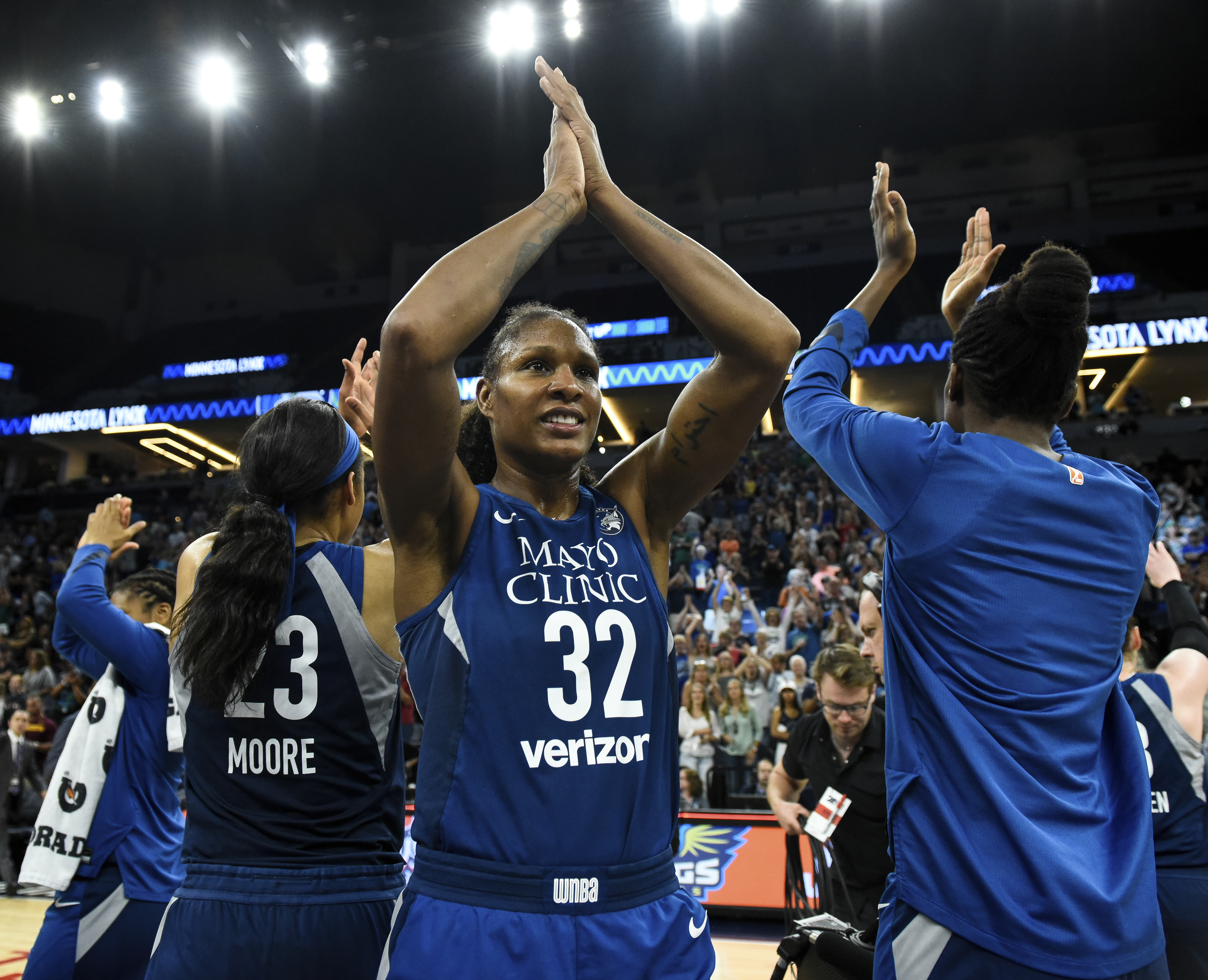 Minnesota forward Rebekkah Brunson (32) celebrates a victory and her WNBA career rebounding record.
