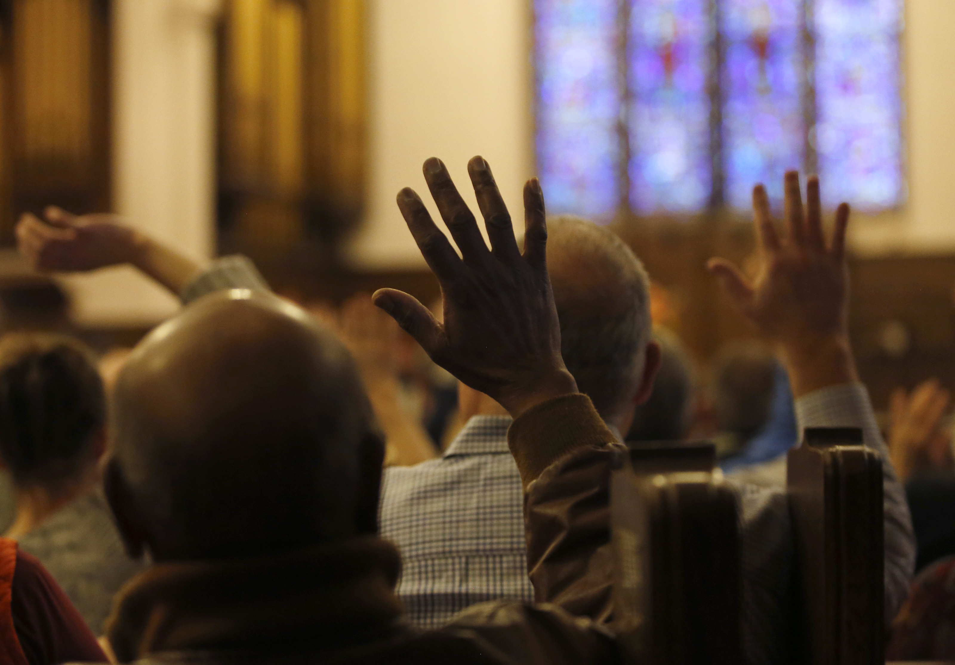 Members of the Winchester Unitarian Society raised their hands to indicate to the children in attendance that they were among those seeking to do good.