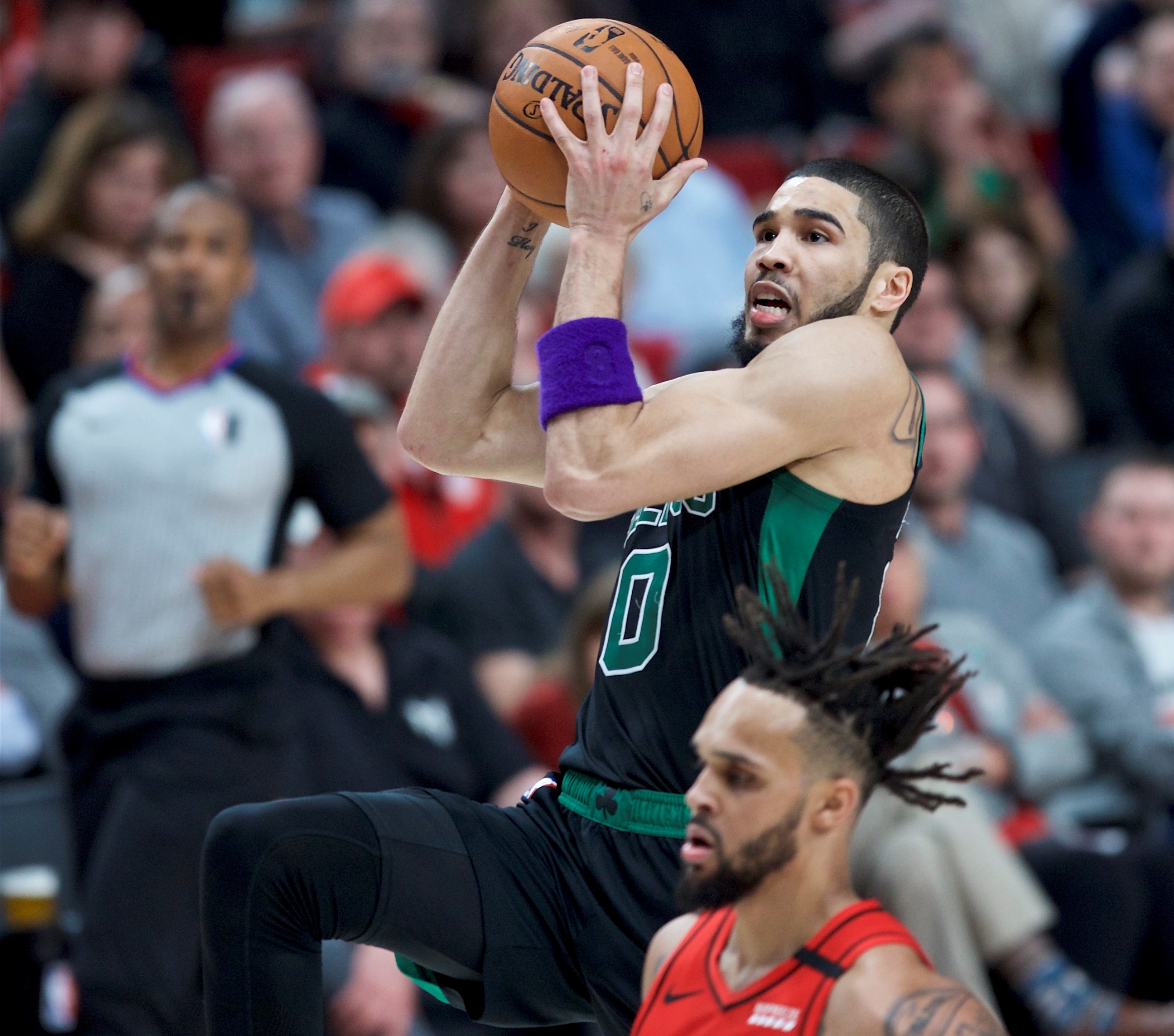 Jayson Tatum shoots over Portland’s Gary Trent Jr. during the second half of the Celtics’ victory Tuesday in Portland, Ore.