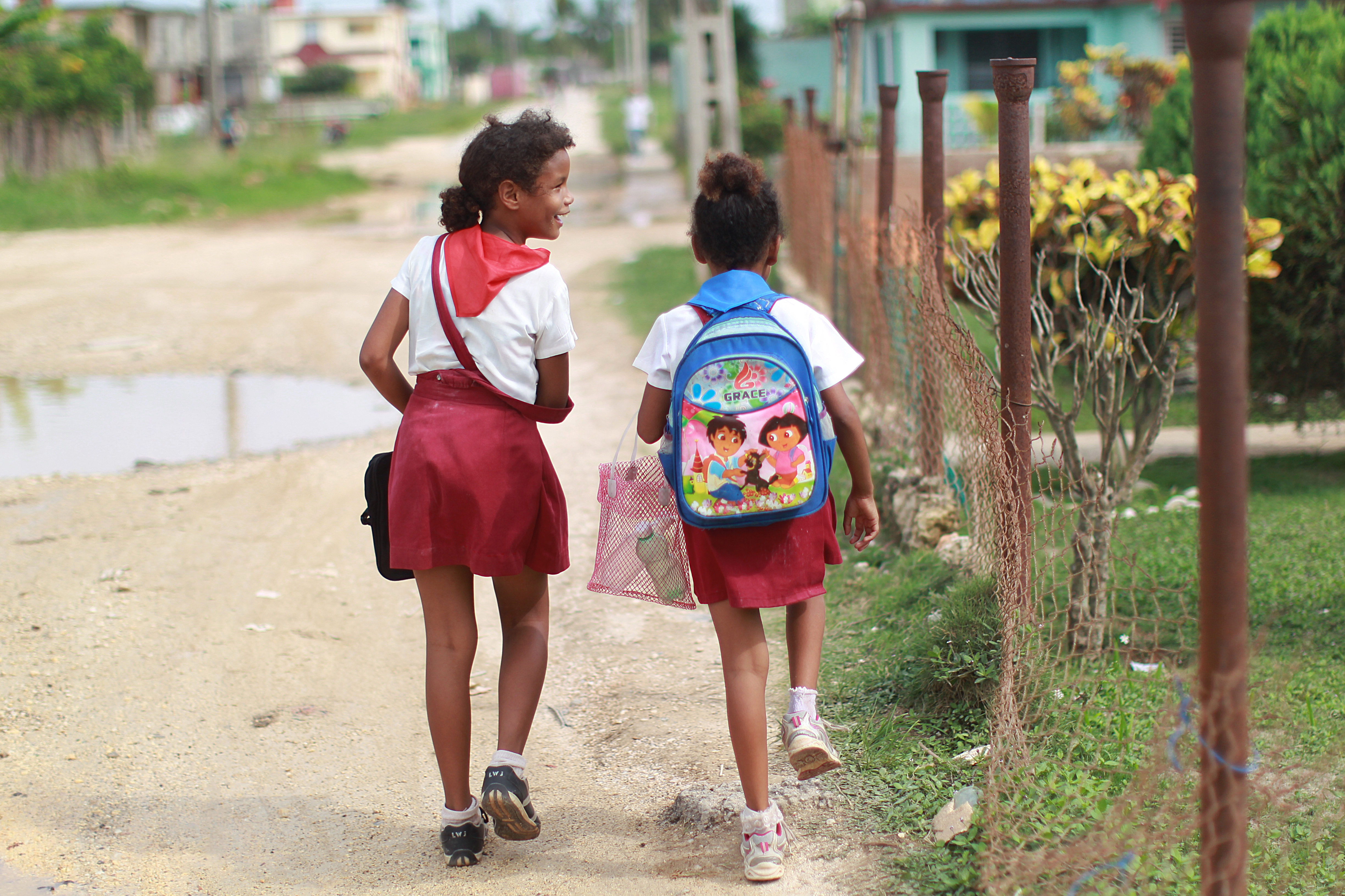 Girls walk along the street in Carbonera, the small Cuban town where the UK government will be building a huge golf resort.