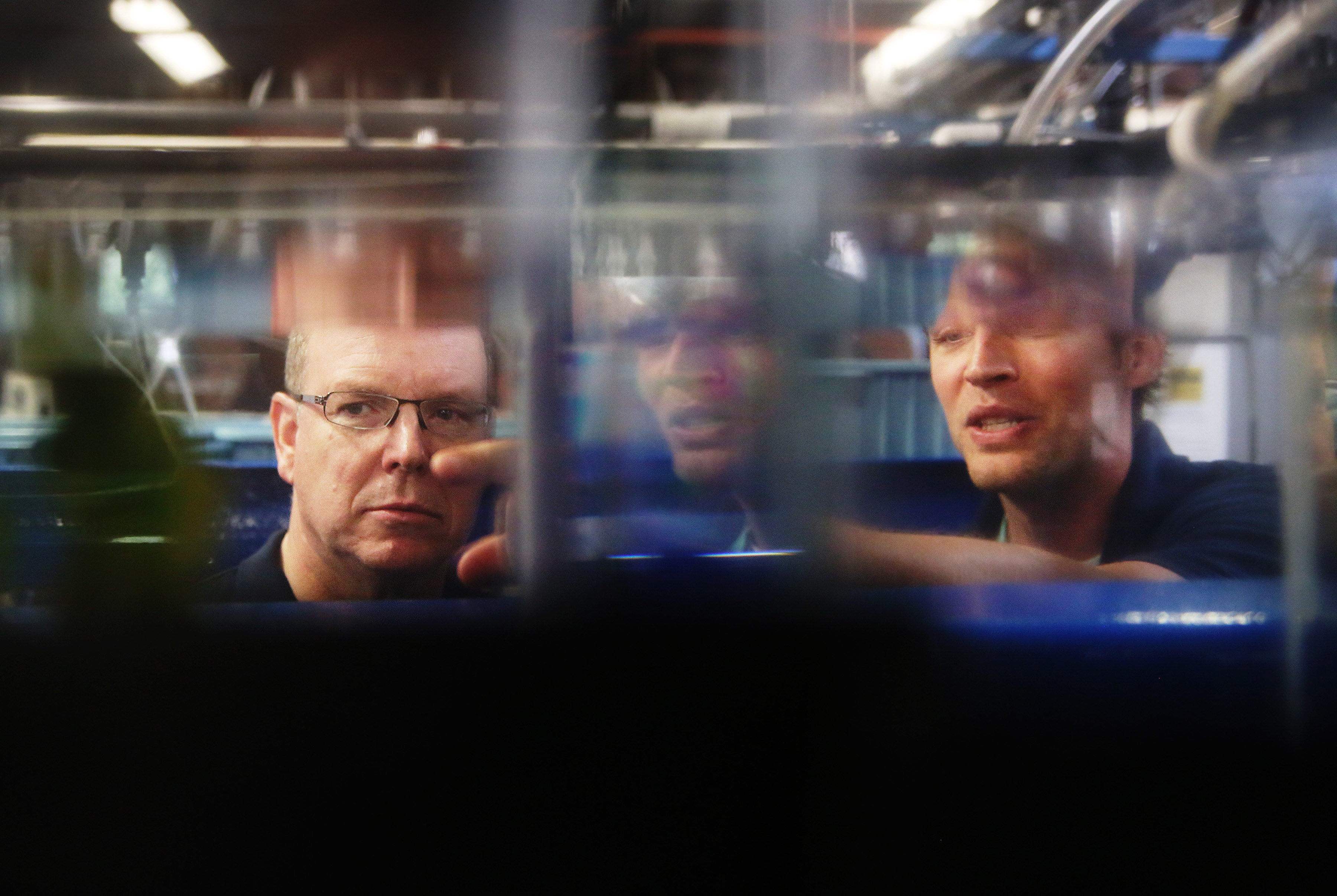 Prince Albert II of Monaco (left) learned about work being done at Marine Biological Laboratory (MBL) by Manager of Cephalopod Operations Bret Grasse.