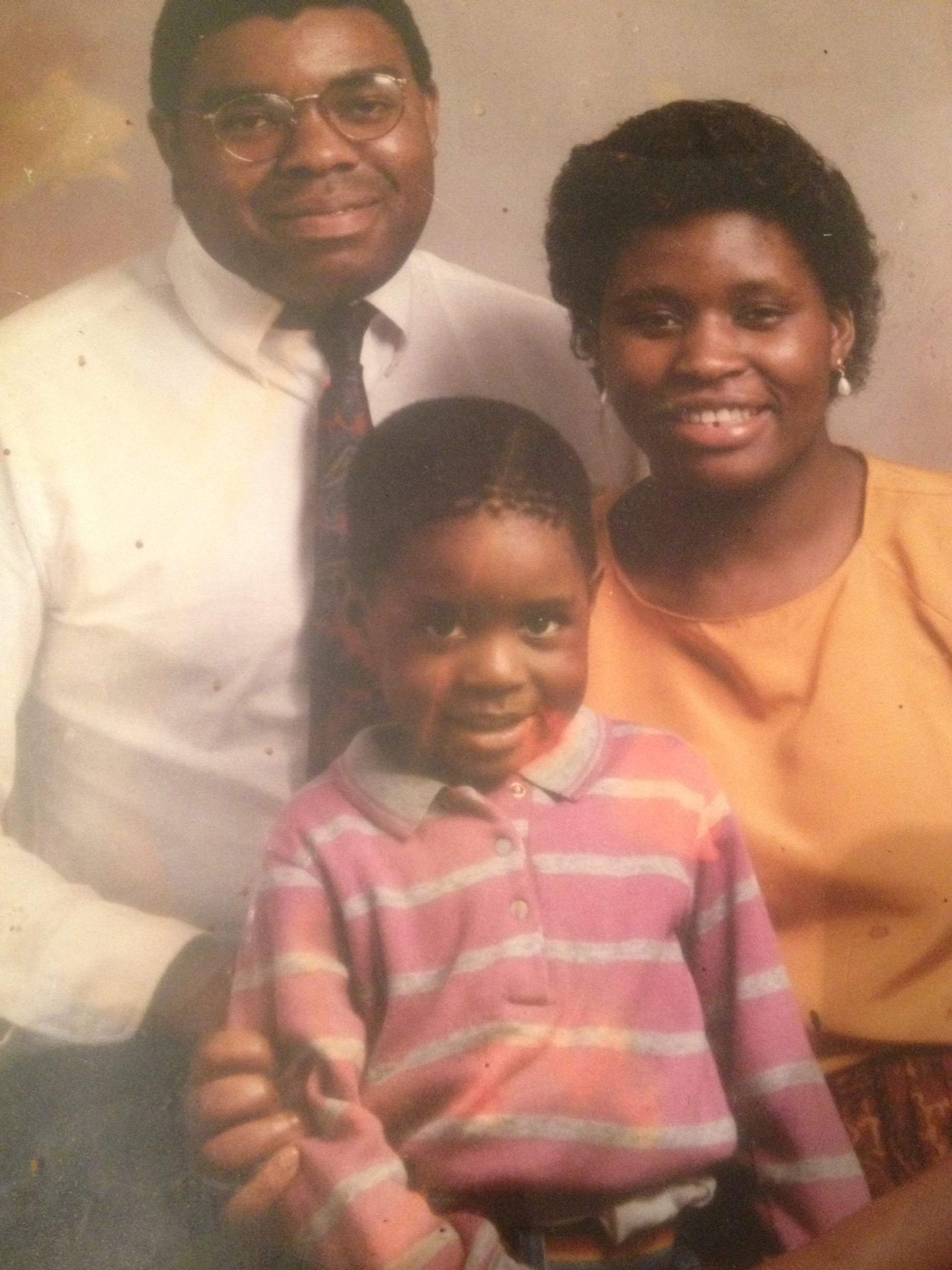 Comedian Tawanda Gona as a child with his parents Phil and Clara Gona.